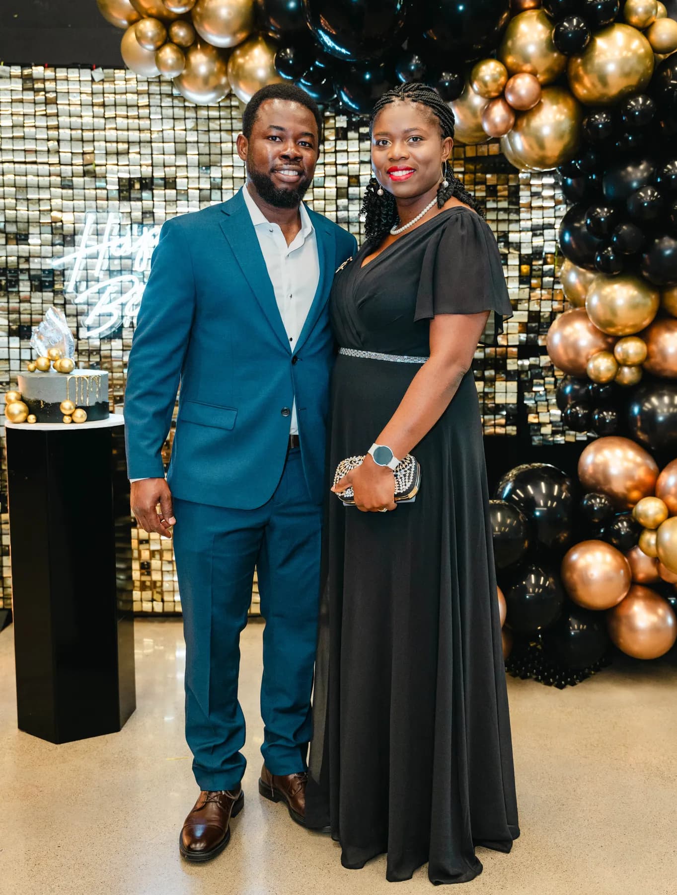 A couple posing together at BJ’s 40th birthday party.