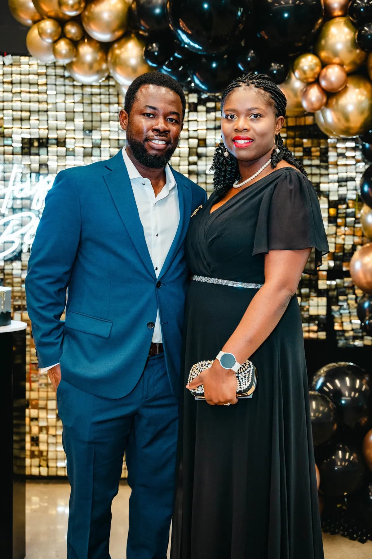 A couple posing together at BJ’s 40th birthday party.