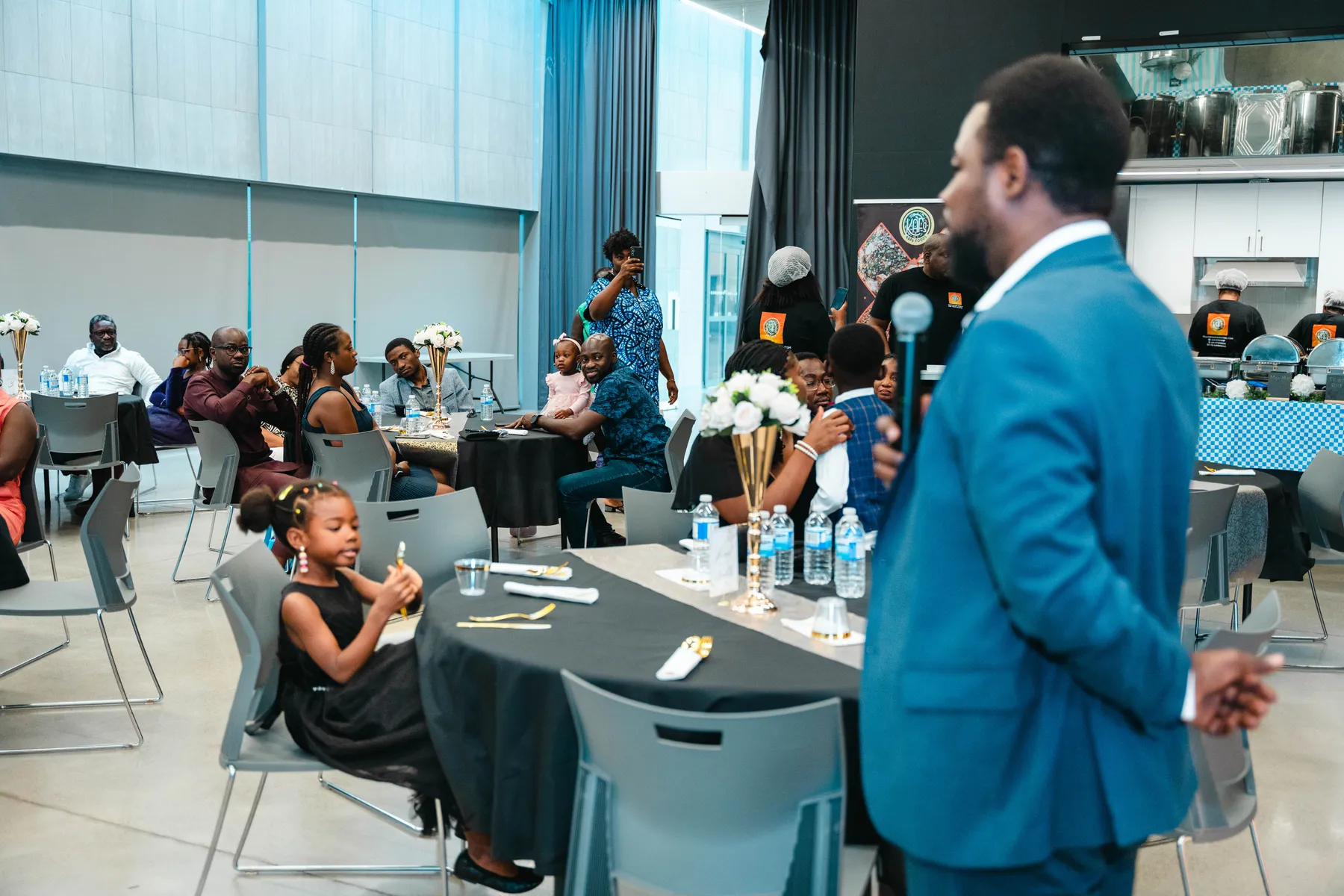 A man addressing the party guests at BJ’s 40th birthday party.
