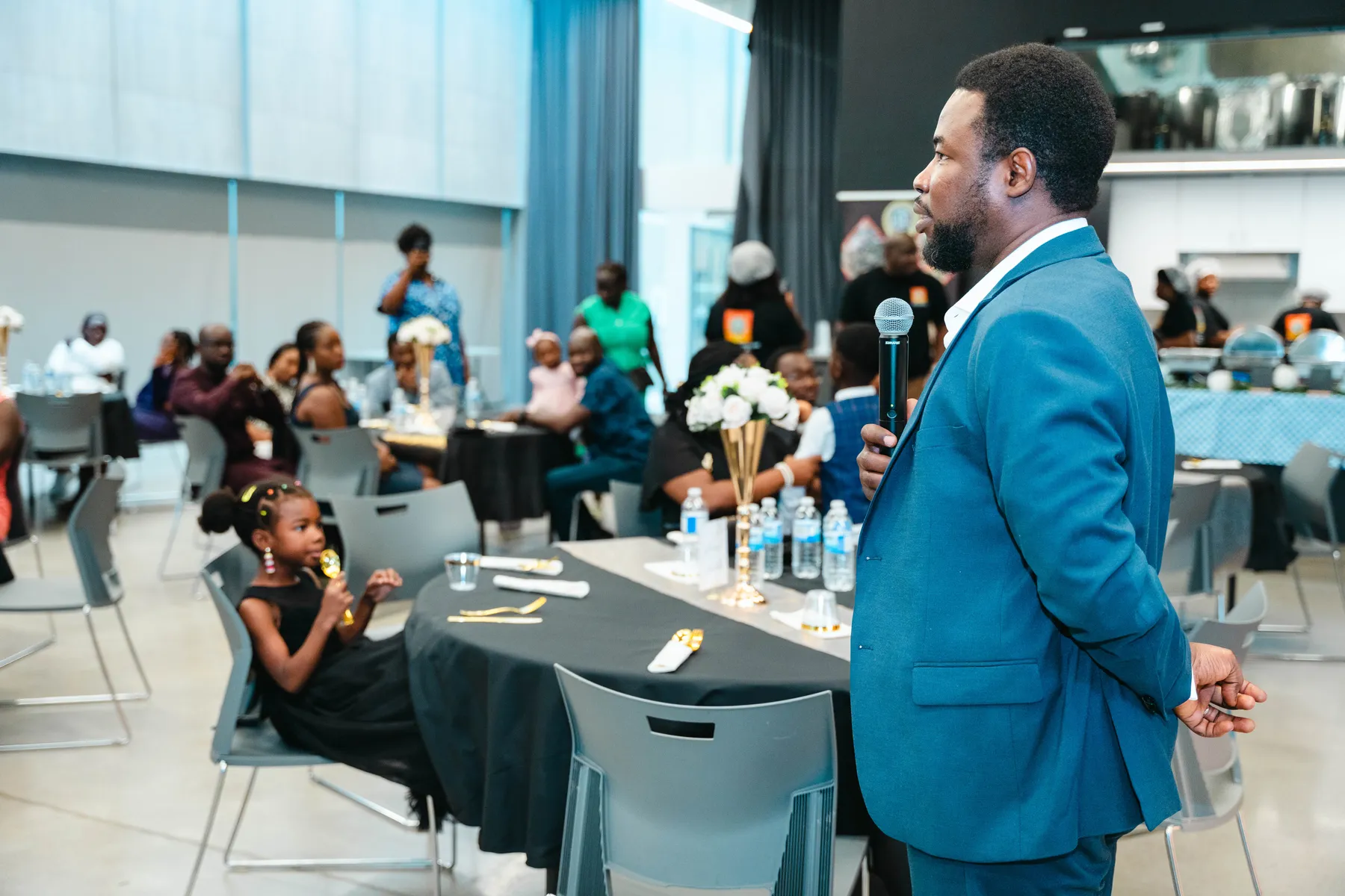A man addressing the party guests at BJ’s 40th birthday party.
