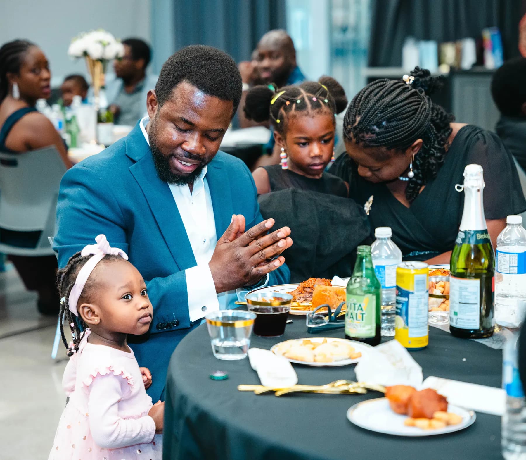 A family at a party table at BJ’s 40th birthday party.