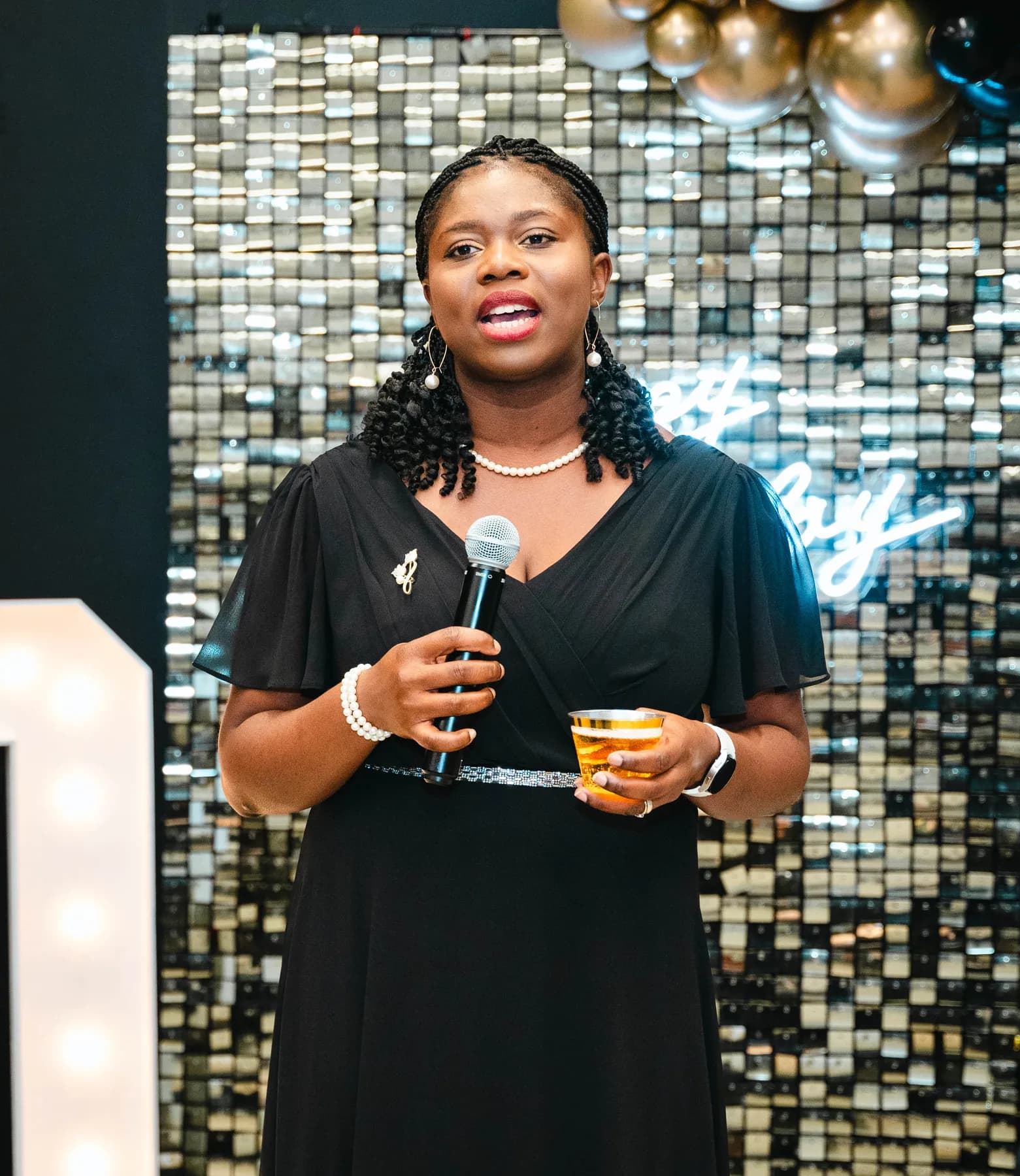 A woman addressing the party guests at BJ’s 40th birthday party.