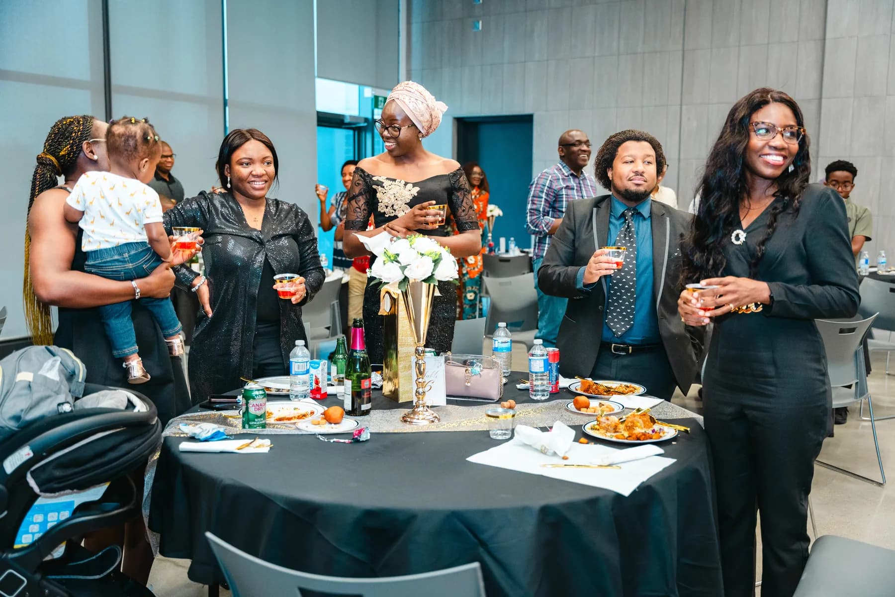 Guests raising their glasses for a toast at BJ’s 40th birthday party.