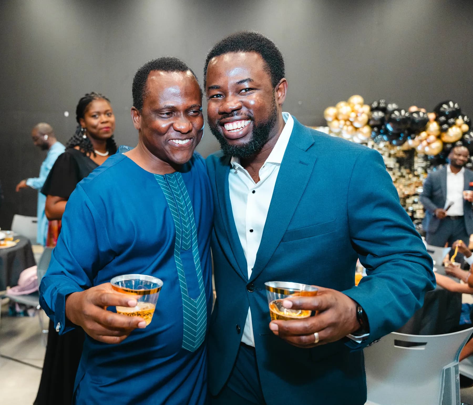 Guests raising their glasses for a toast at BJ’s 40th birthday party.