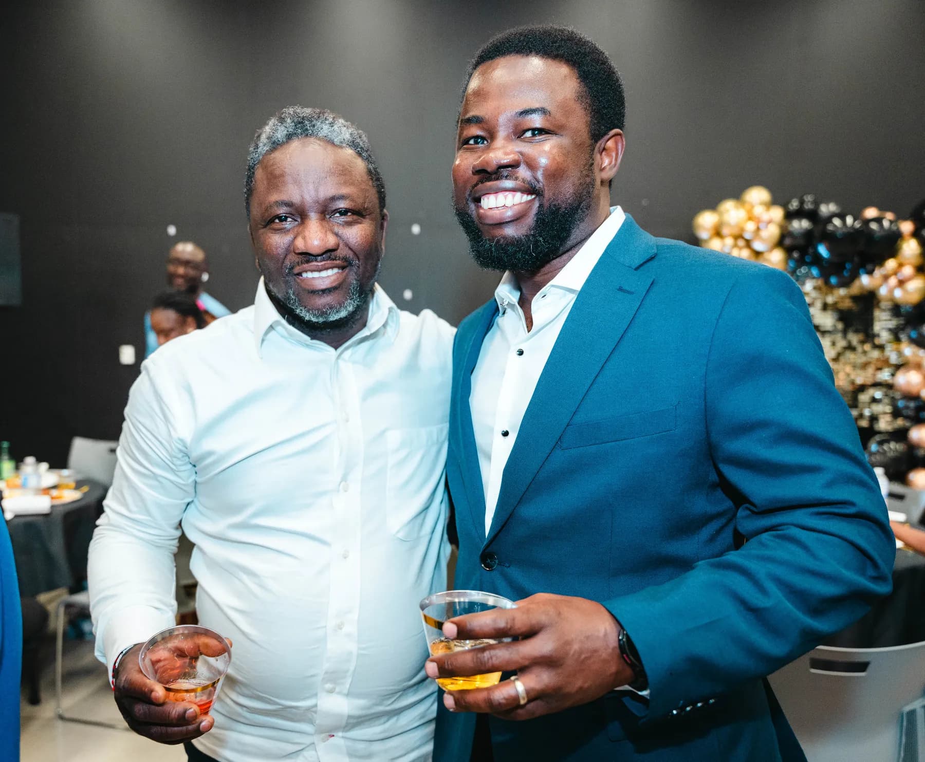 Guests raising their glasses for a toast at BJ’s 40th birthday party.