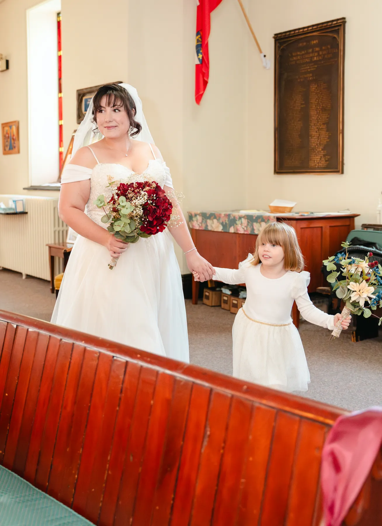 The bride entering the church with a child at Kody and Jaz’s wedding.