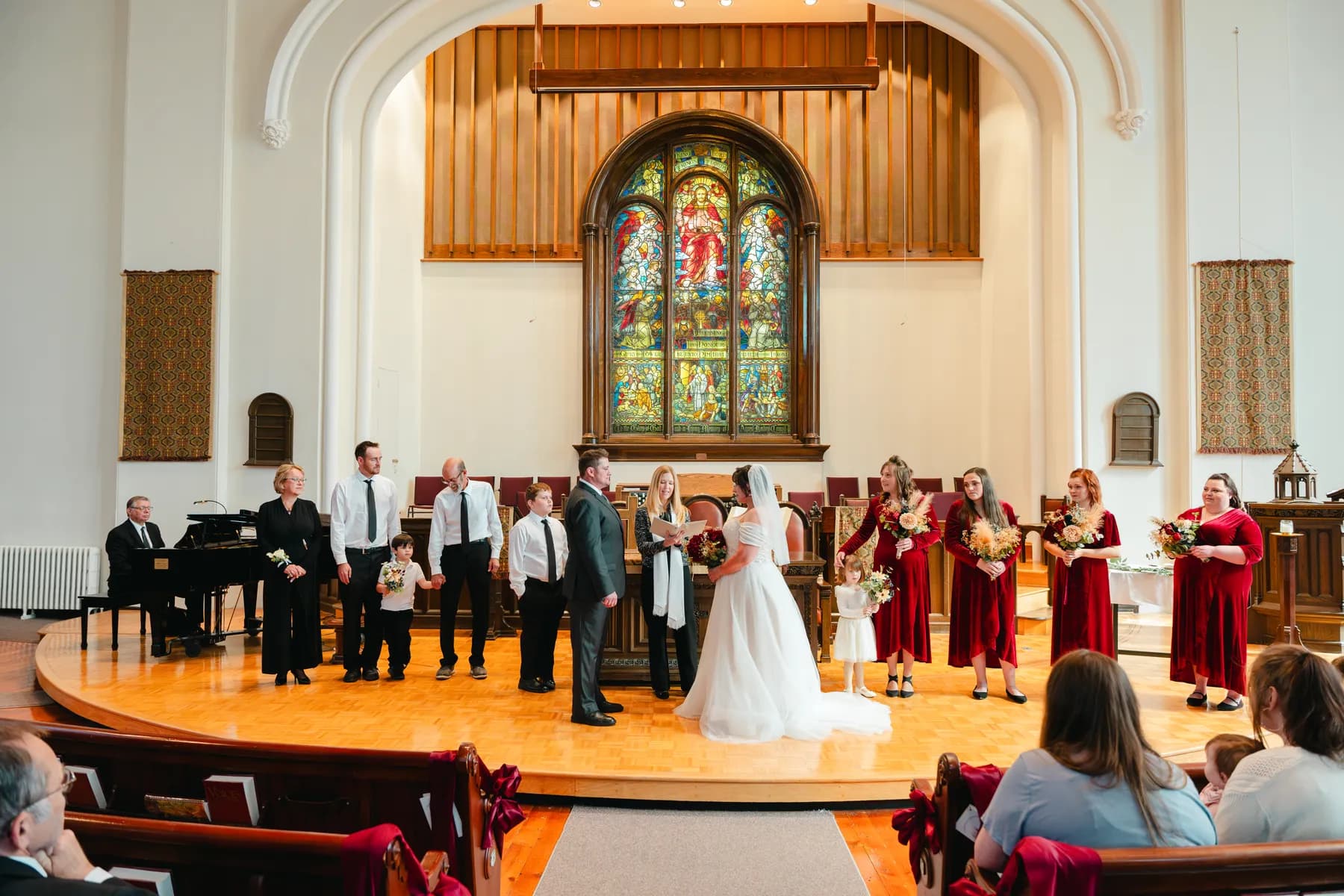 The couple and wedding party during the church ceremony at Kody and Jaz’s wedding.