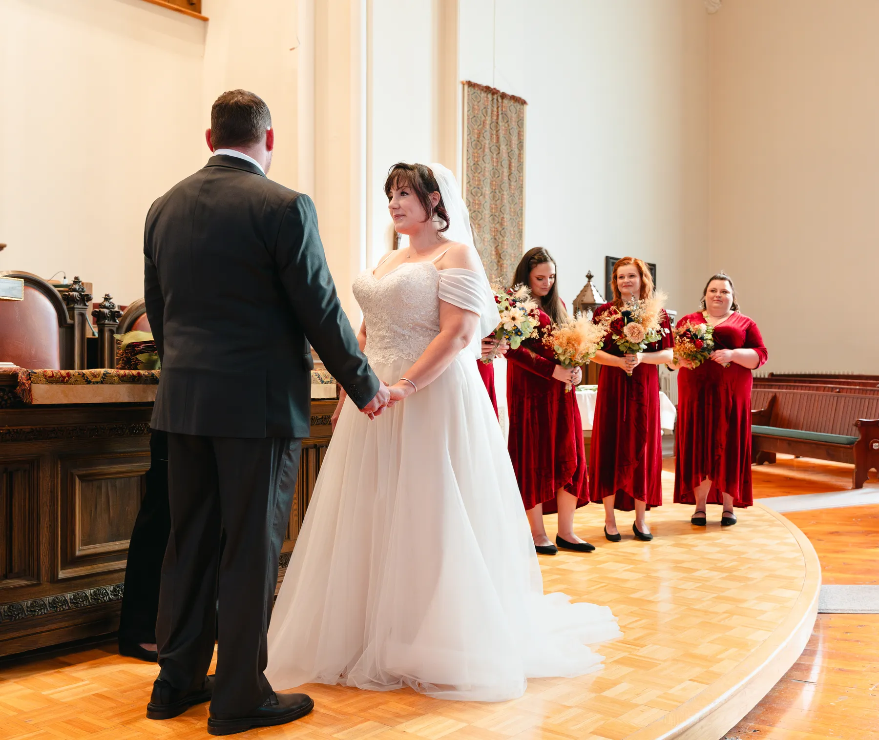 The couple and wedding party during the church ceremony at Kody and Jaz’s wedding.