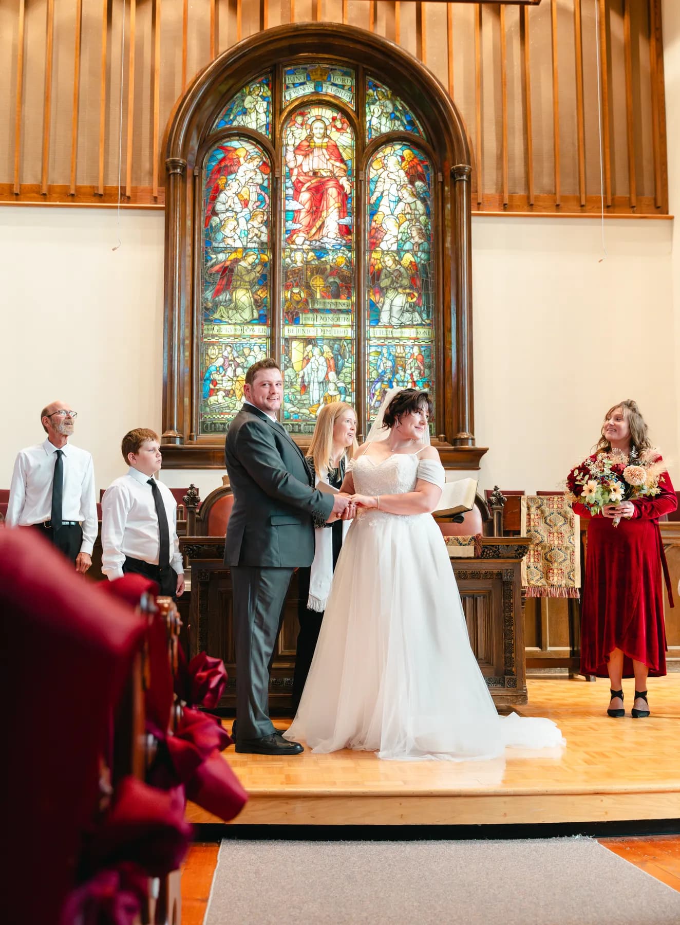 The couple and wedding party during the church ceremony at Kody and Jaz’s wedding.