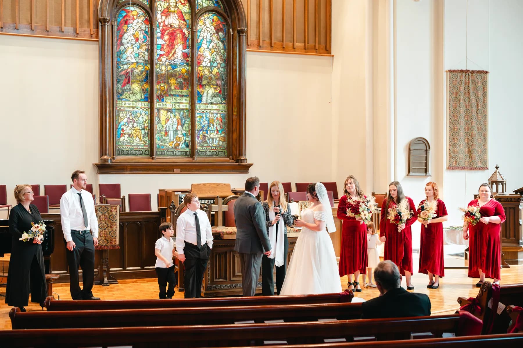 The couple and wedding party during the church ceremony at Kody and Jaz’s wedding.