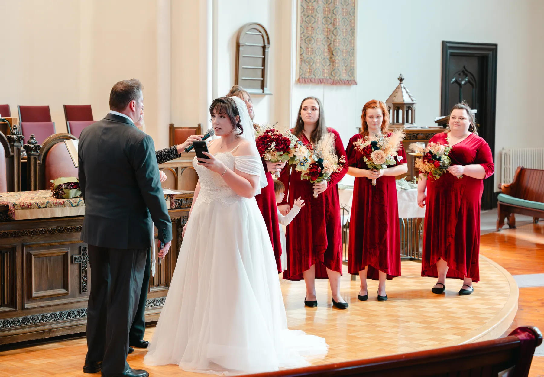 The couple and wedding party during the church ceremony at Kody and Jaz’s wedding.
