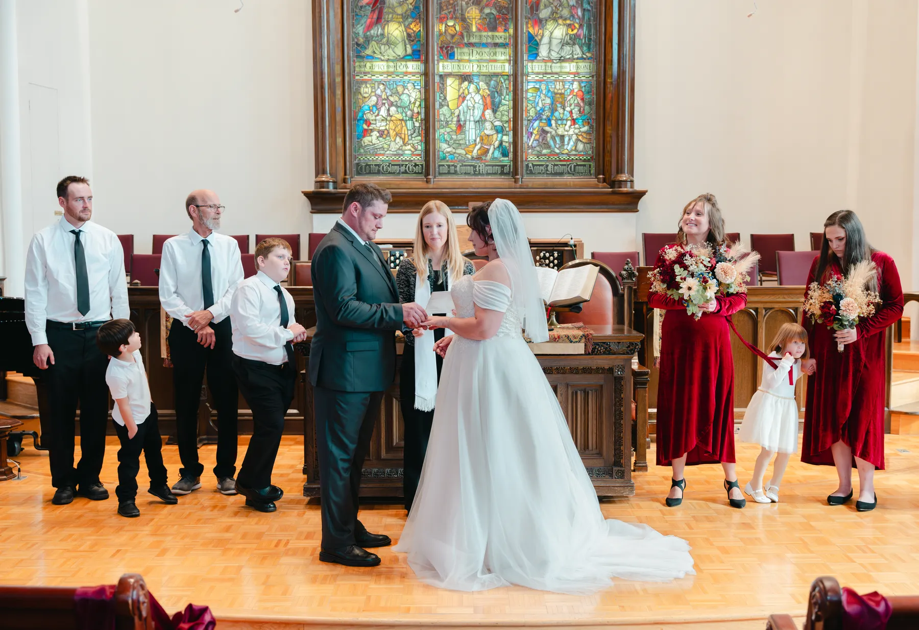 The couple and wedding party during the church ceremony at Kody and Jaz’s wedding.