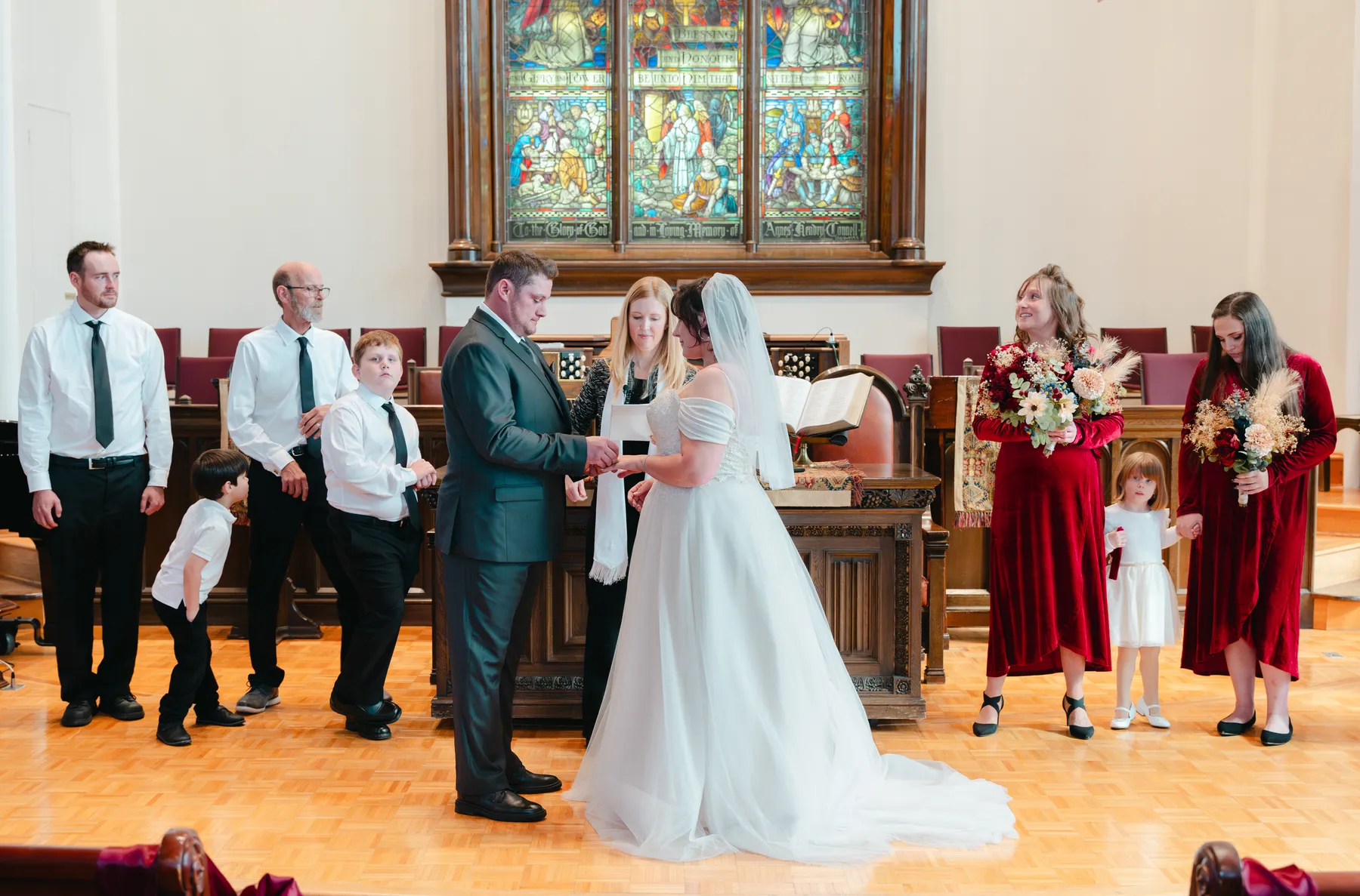 The couple and wedding party during the church ceremony at Kody and Jaz’s wedding.