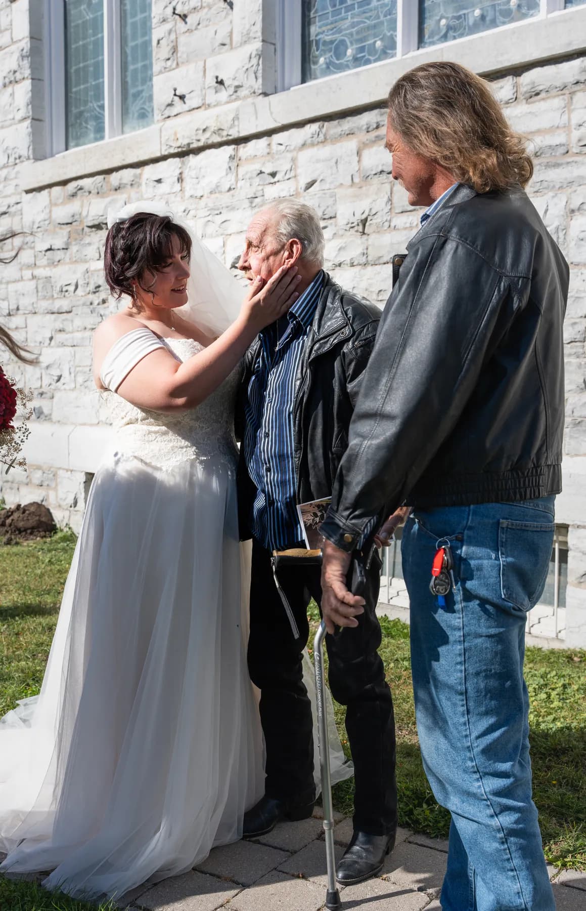 The bride with guests outside the church at Kody and Jaz’s wedding.