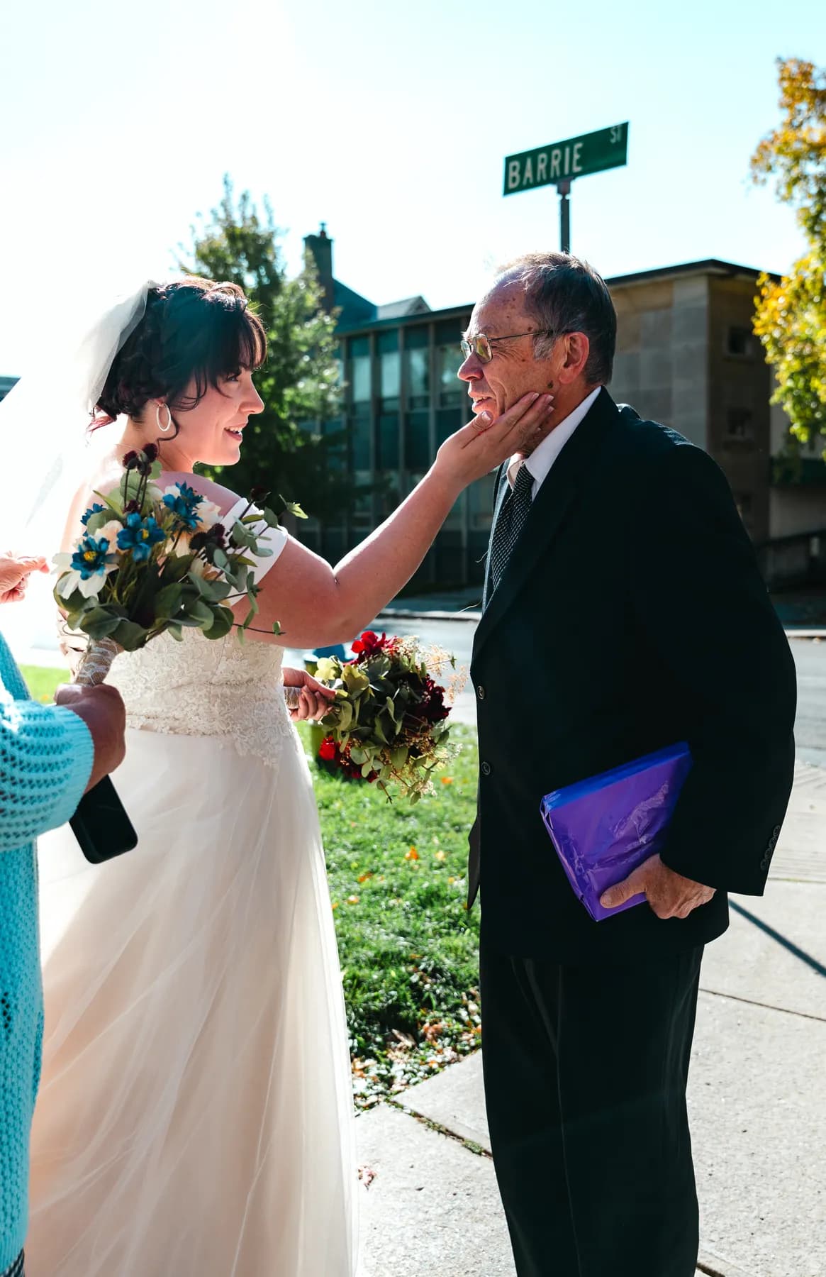 The bride with guests outdoors at Kody and Jaz’s wedding.