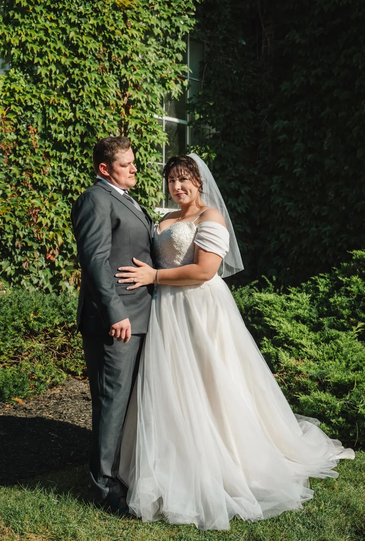 The couple posing in the garden at Kody and Jaz’s wedding.