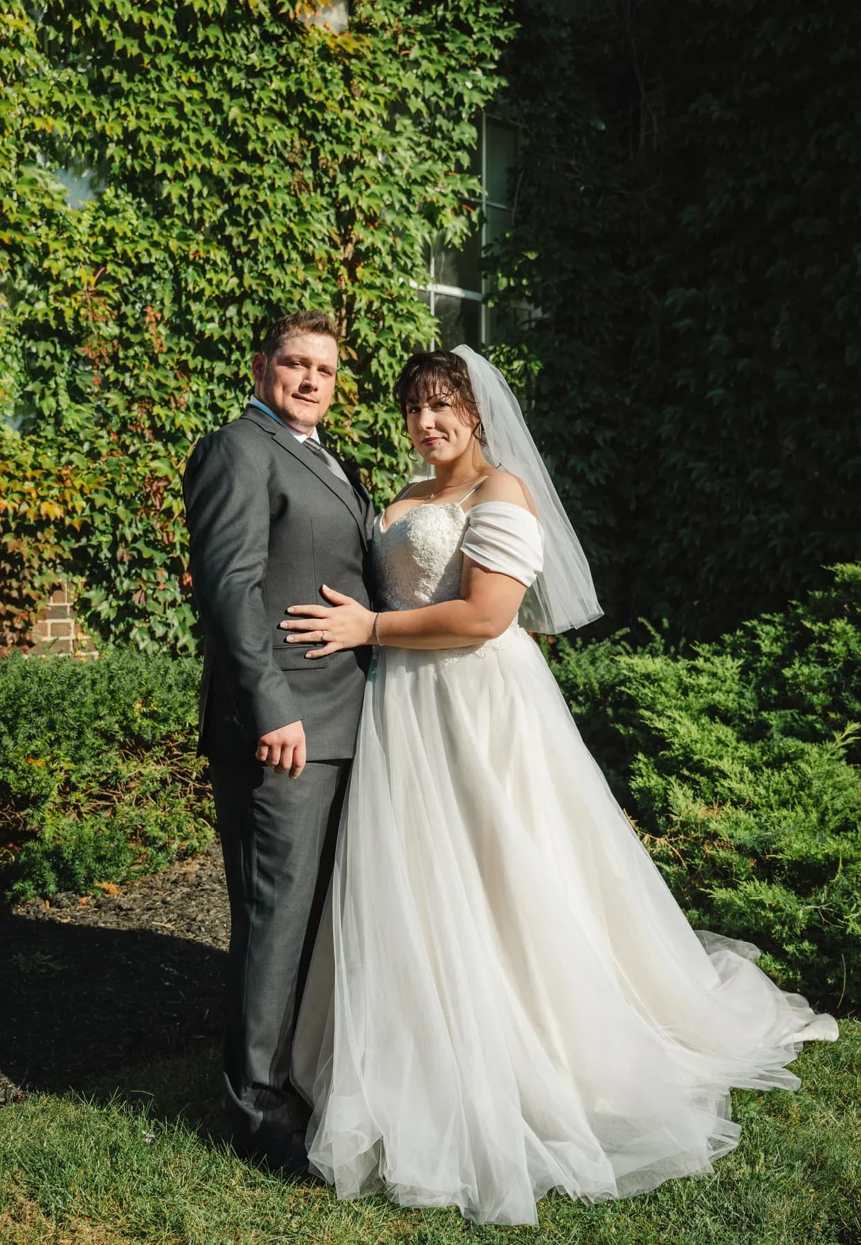 The couple posing in the garden at Kody and Jaz’s wedding.