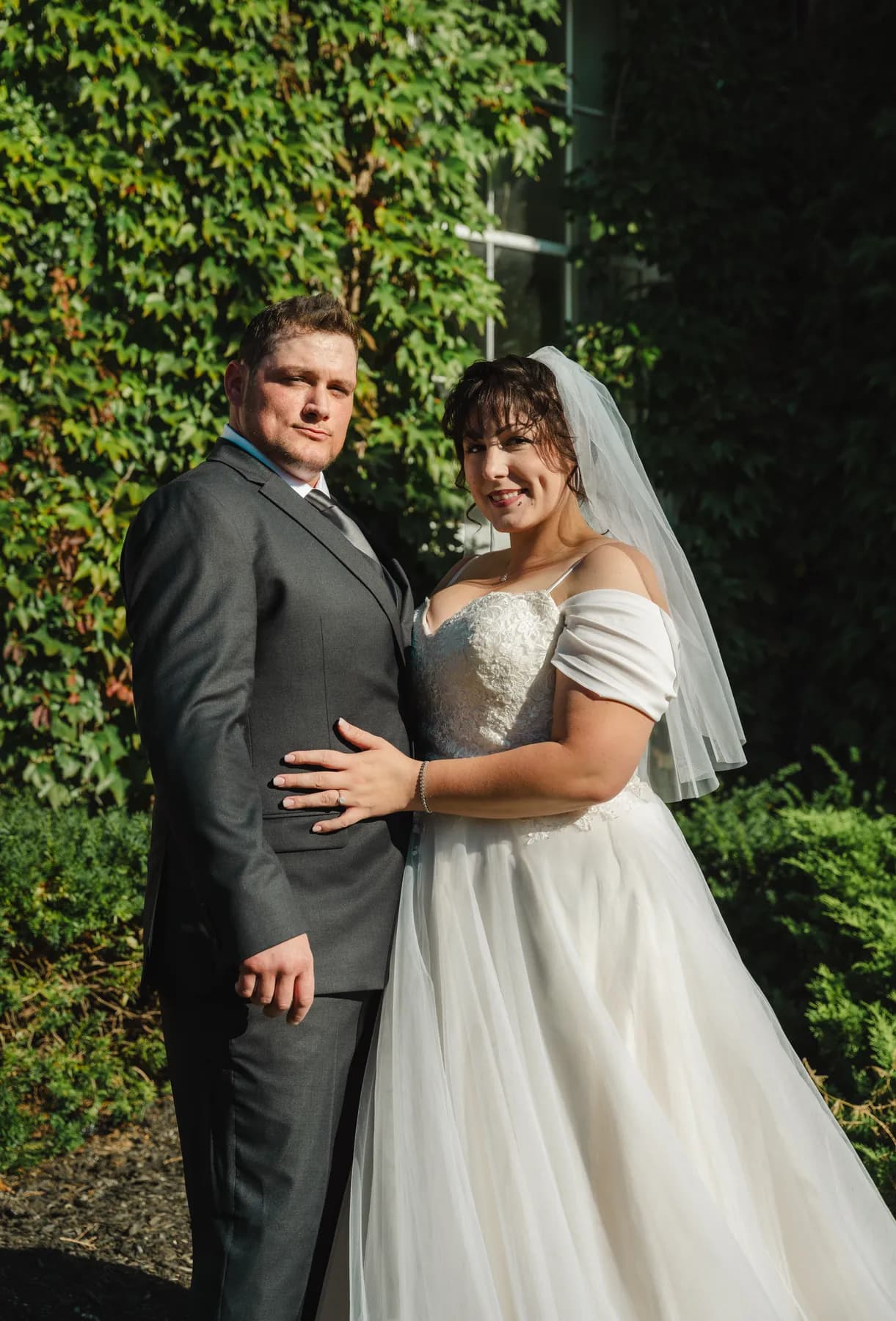 The couple posing in the garden at Kody and Jaz’s wedding.