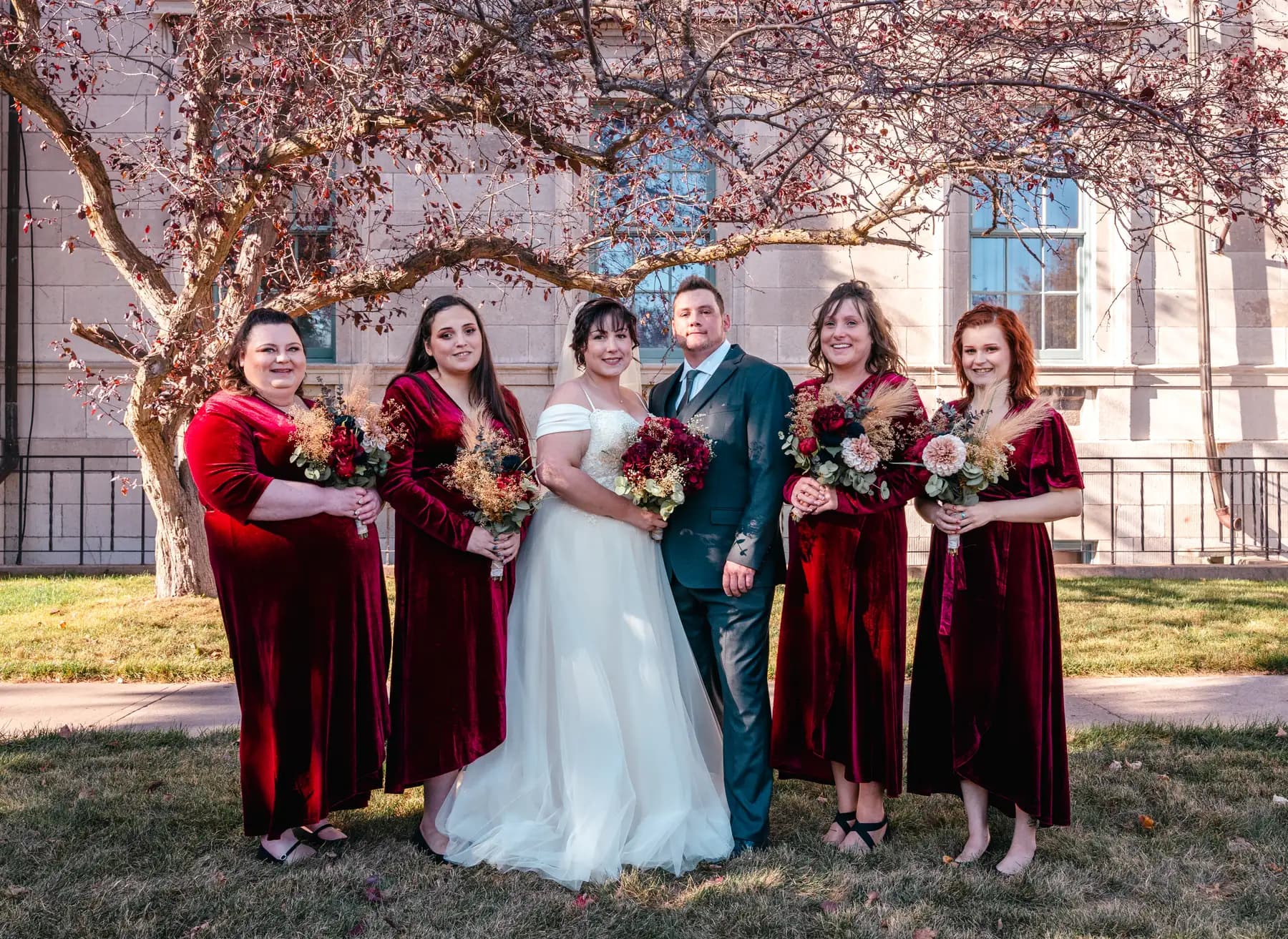 The bride and bridesmaids outdoors at Kody and Jaz’s wedding.