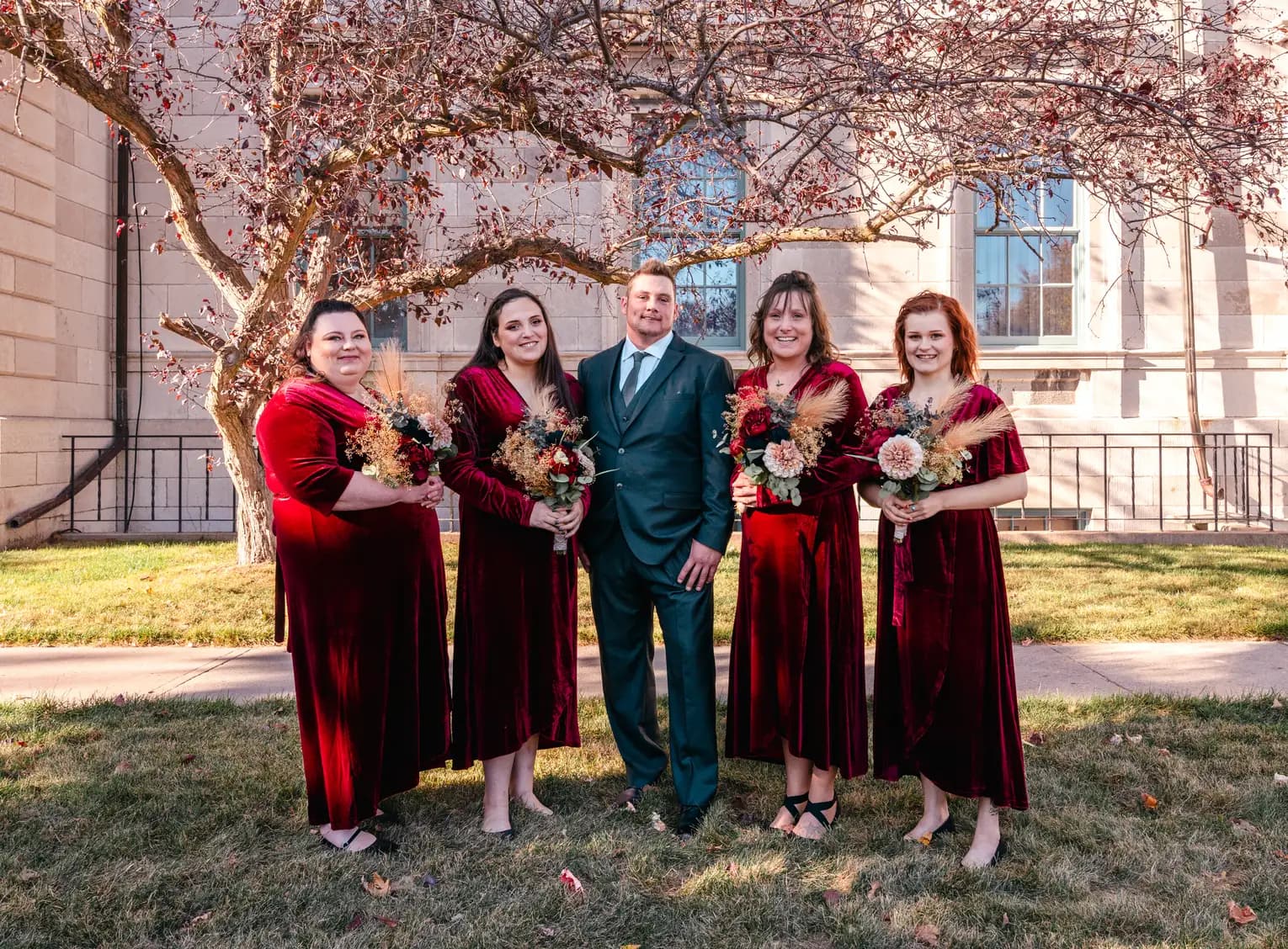 The bride and bridesmaids outdoors at Kody and Jaz’s wedding.