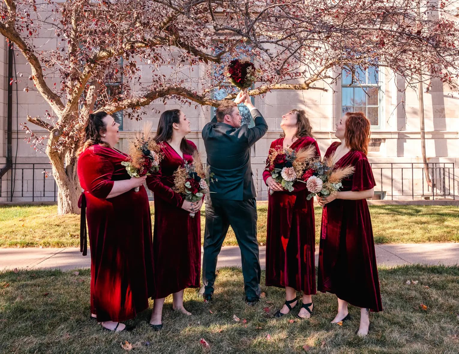 The bride and bridesmaids outdoors at Kody and Jaz’s wedding.