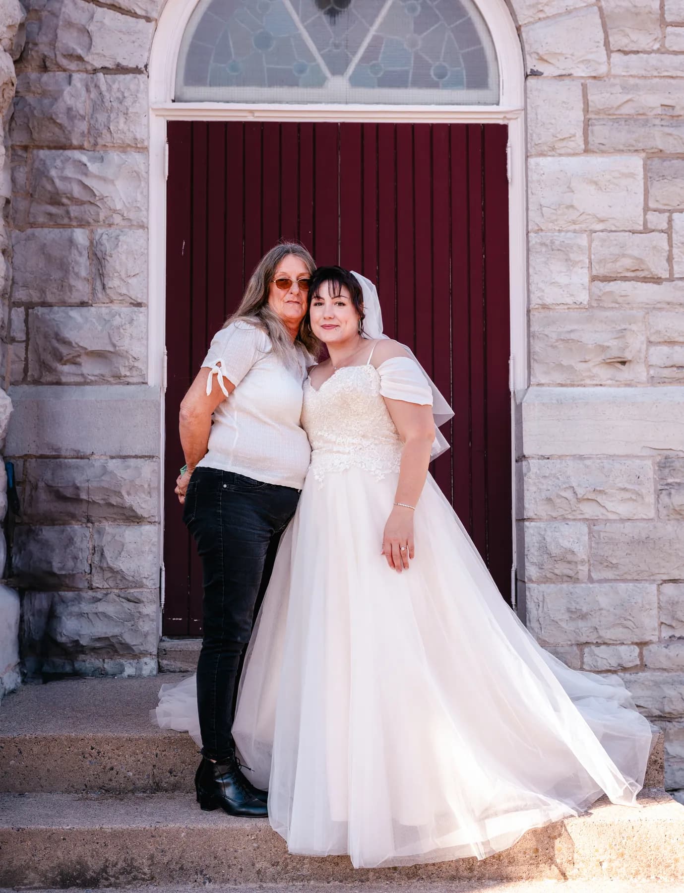 The bride posing outside the church at Kody and Jaz’s wedding.