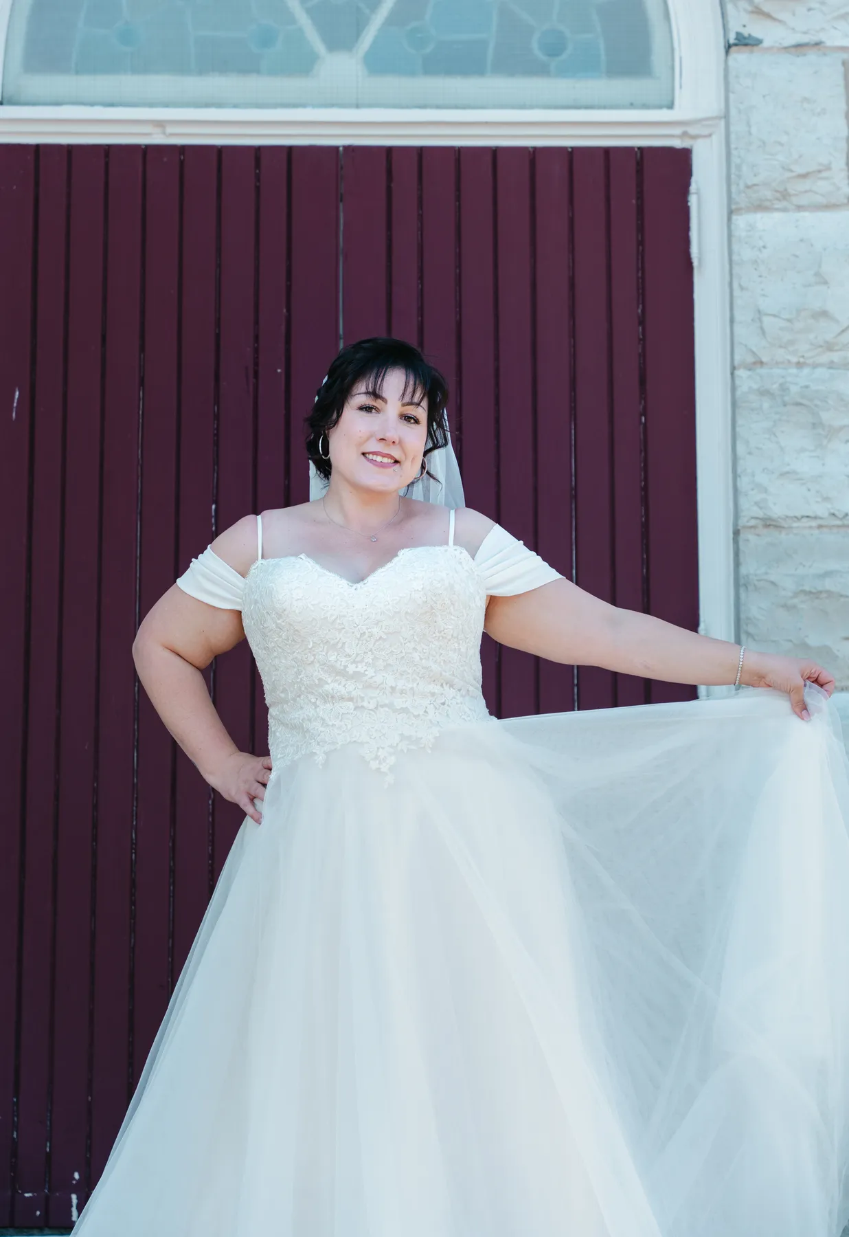 The bride posing outside the church at Kody and Jaz’s wedding.