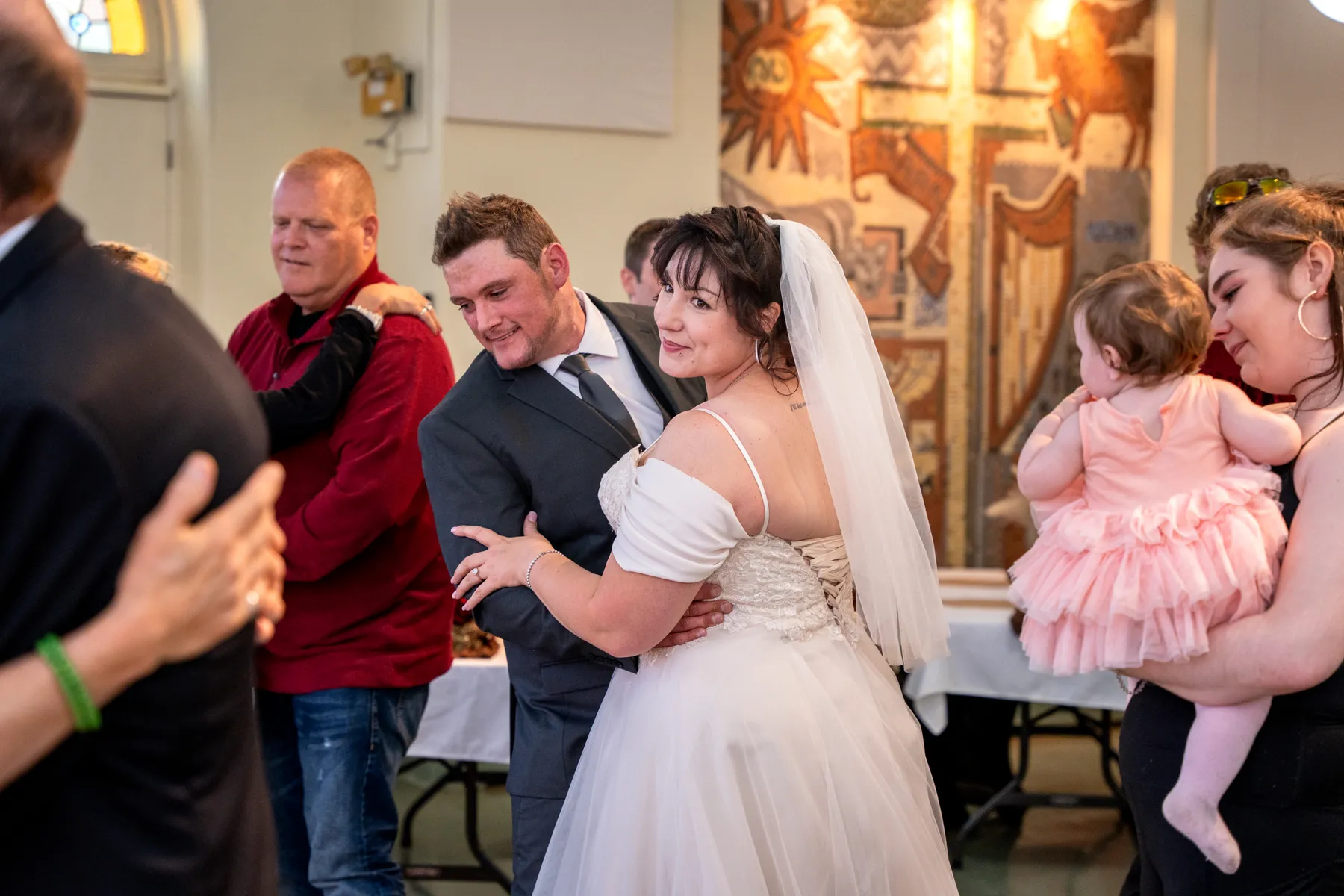 The couple and guests dancing at the reception at Kody and Jaz’s wedding.