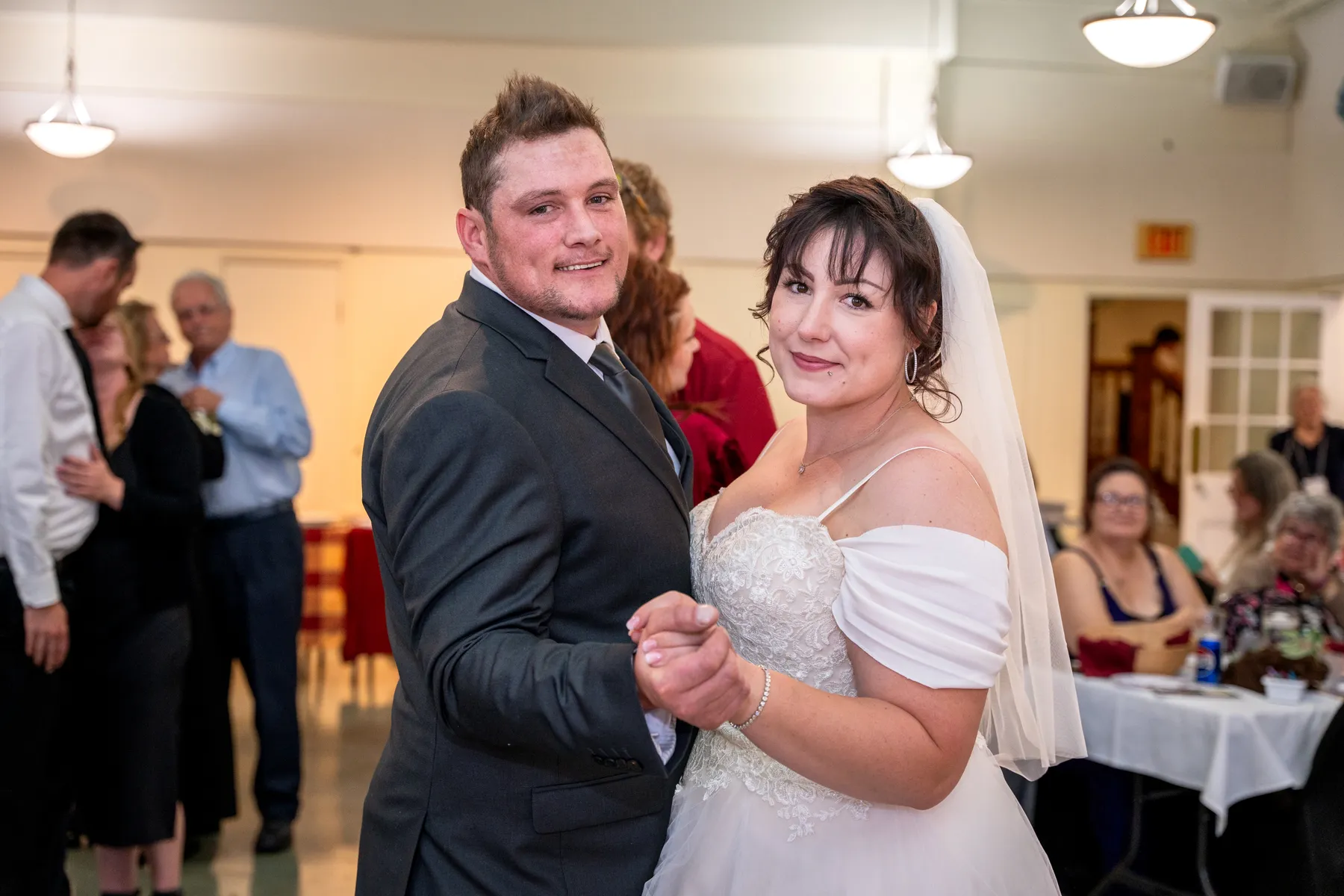 The couple and guests dancing at the reception at Kody and Jaz’s wedding.
