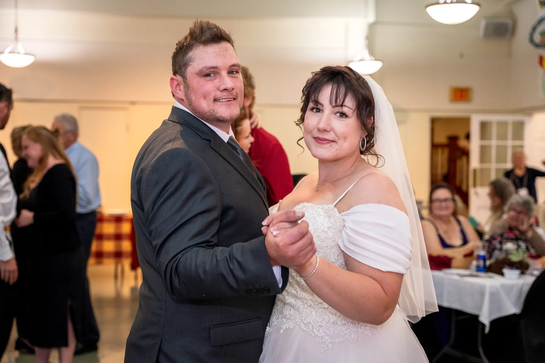 The couple and guests dancing at the reception at Kody and Jaz’s wedding.