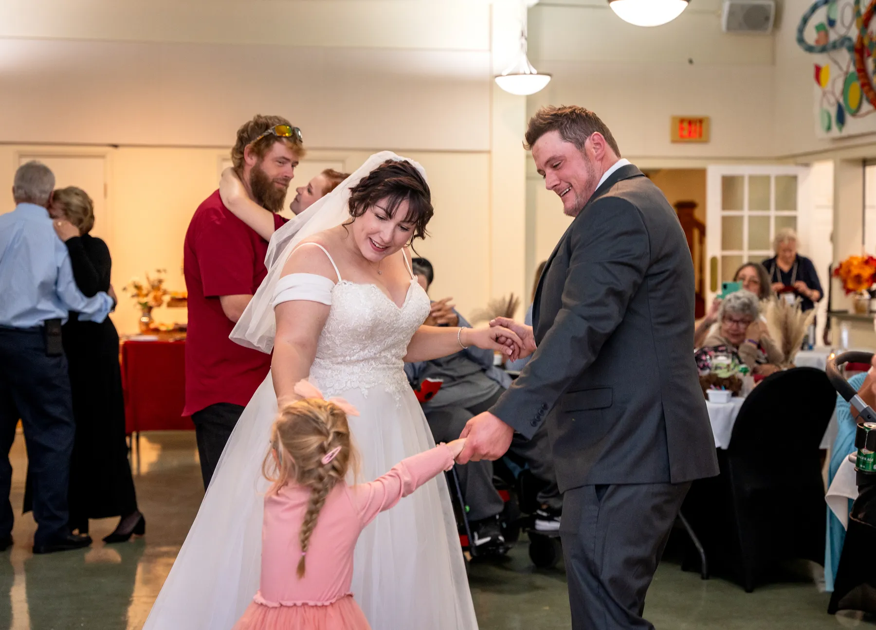 The couple and guests dancing at the reception at Kody and Jaz’s wedding.