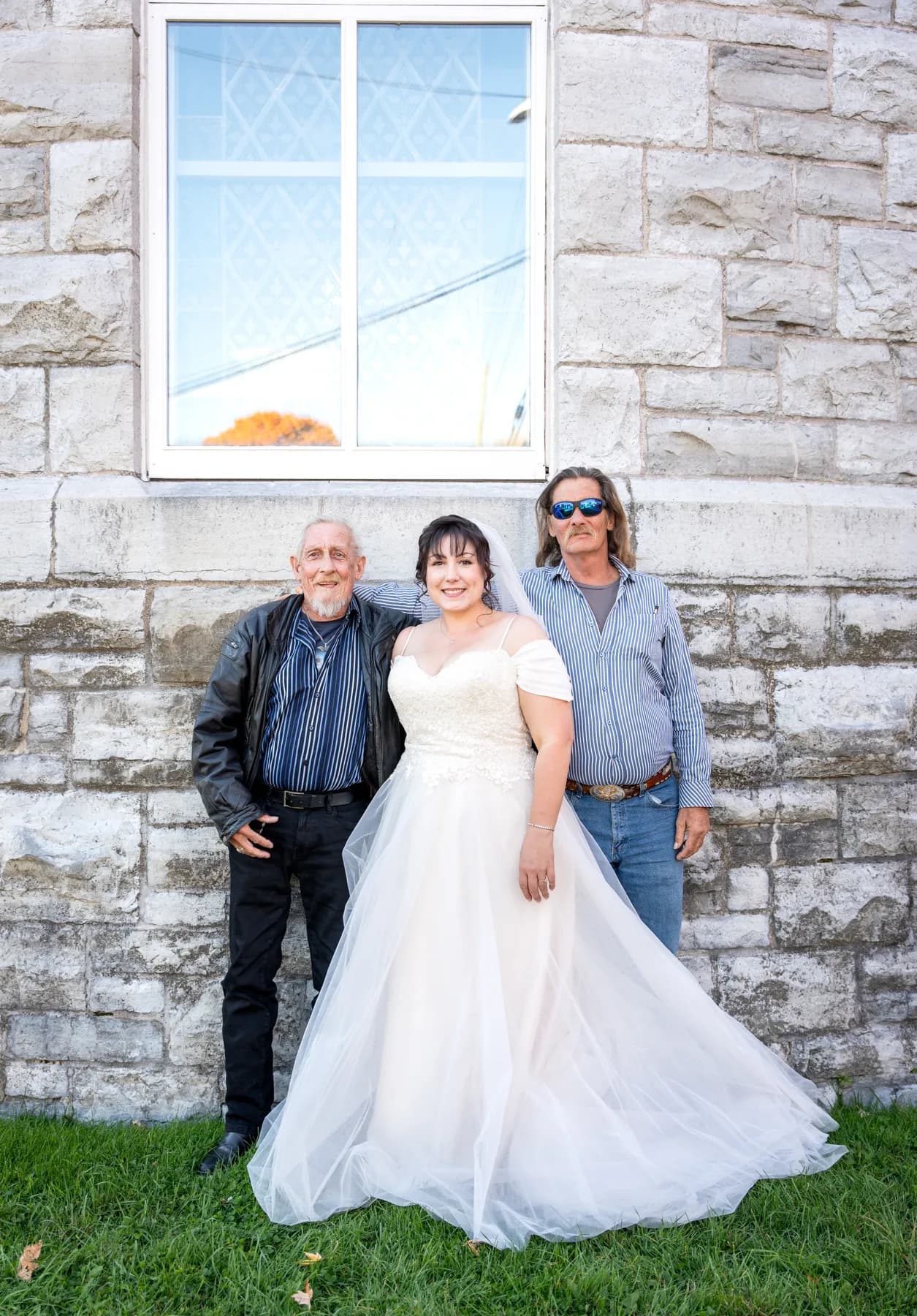 The bride with guests outside the church at Kody and Jaz’s wedding.