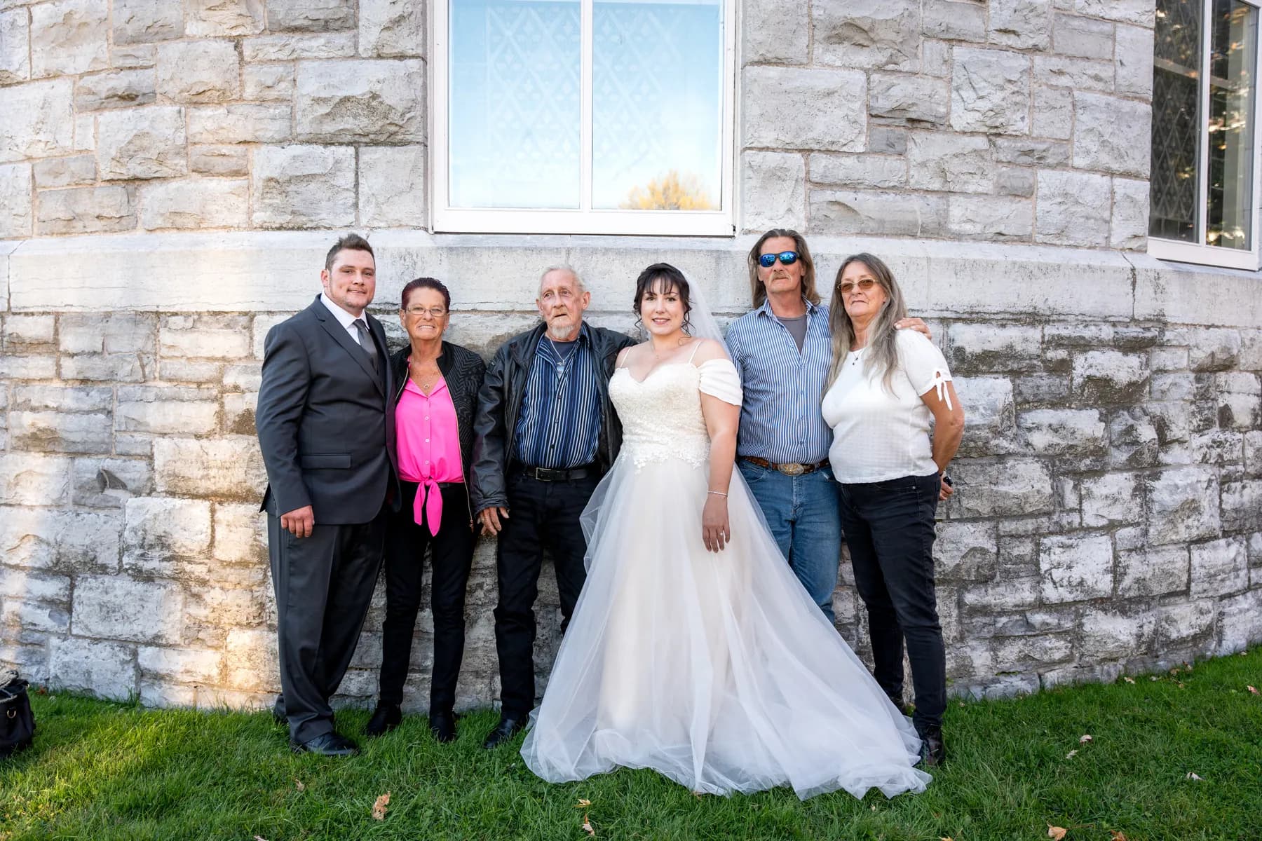 The bride with guests outside the church at Kody and Jaz’s wedding.