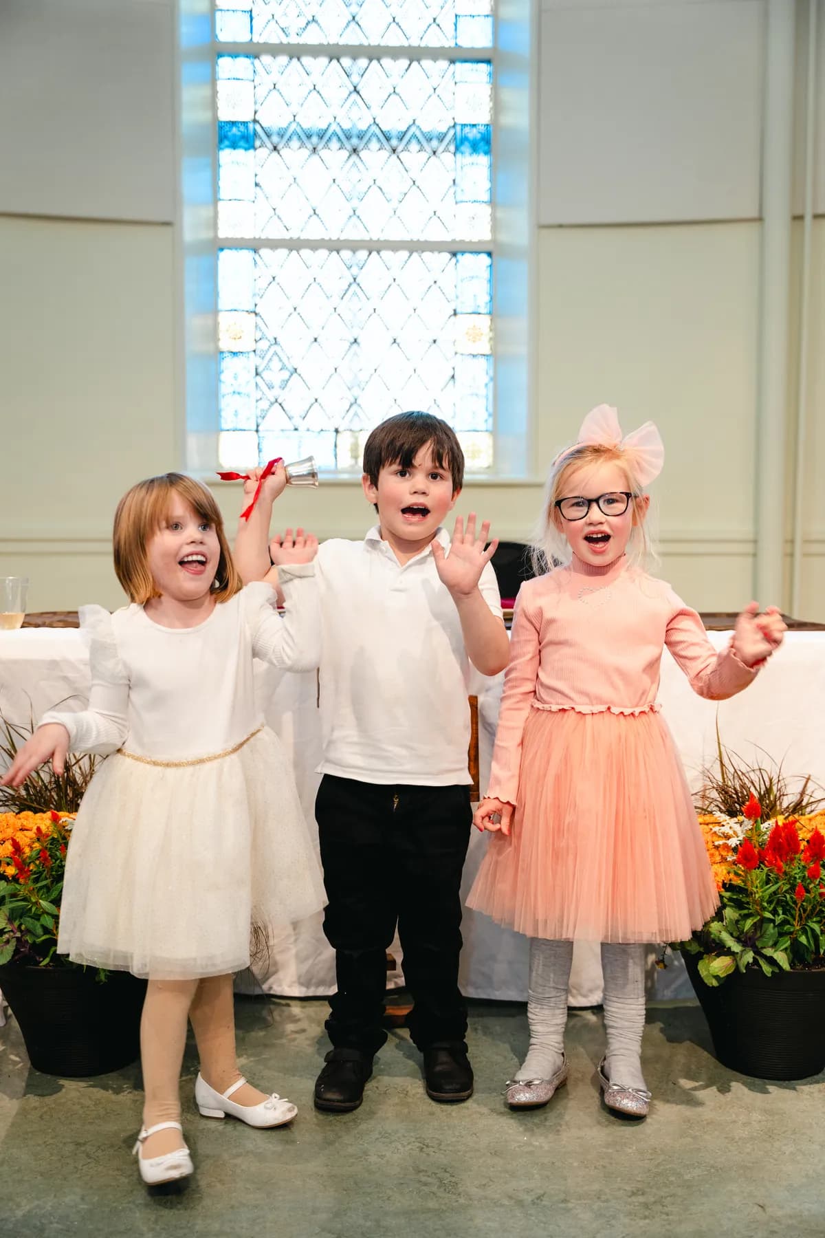 Children posing at the reception at Kody and Jaz’s wedding.