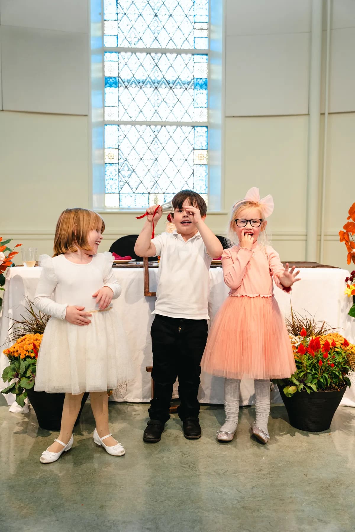 Children posing at the reception at Kody and Jaz’s wedding.