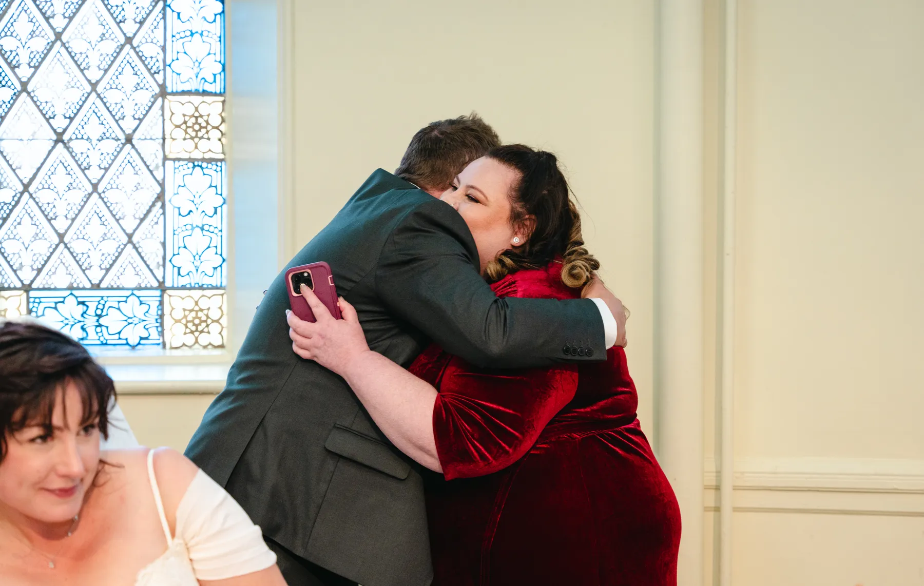 The bride greeting and hugging guests at Kody and Jaz’s wedding.