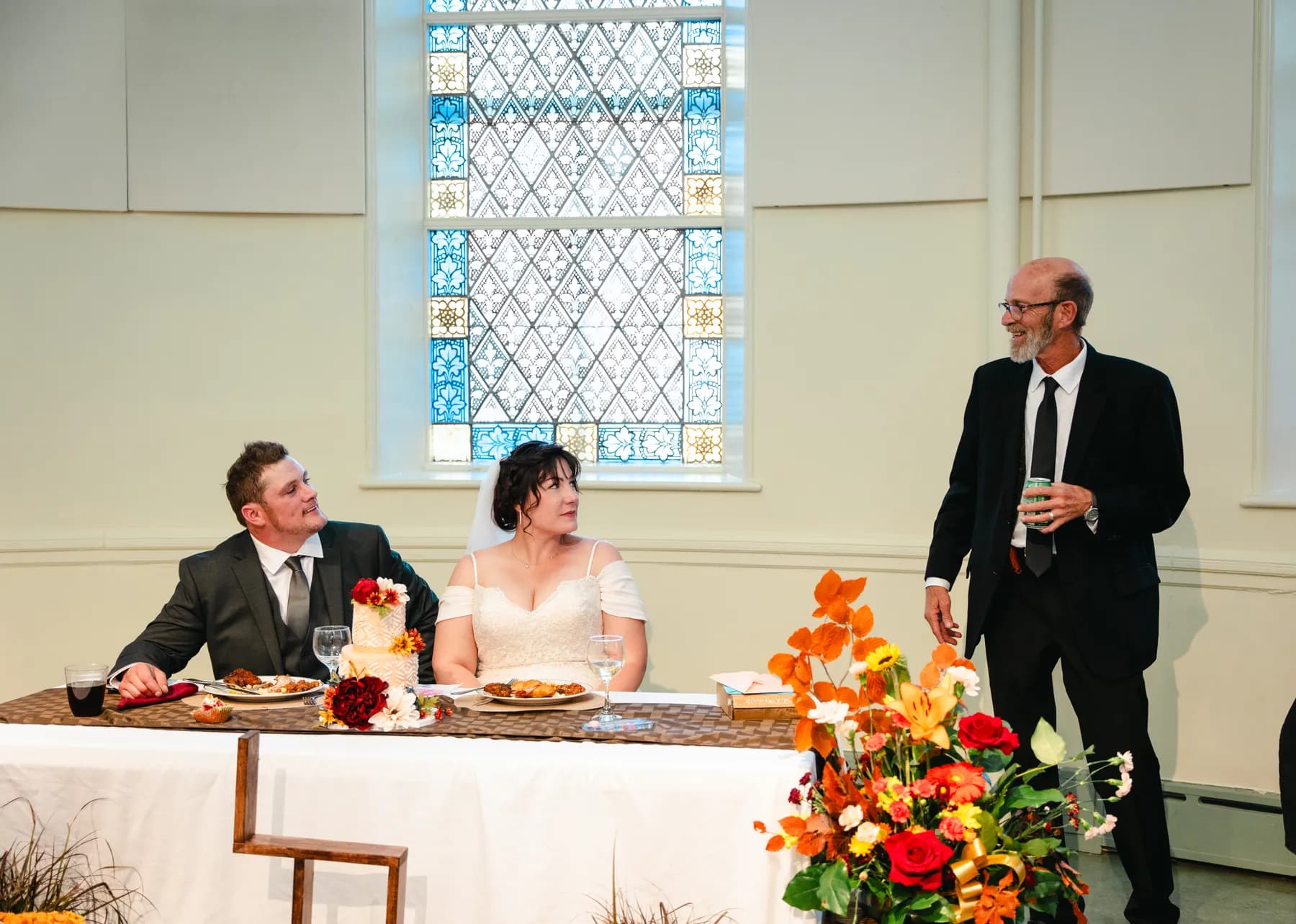 Guests giving reception speeches and toasts at Kody and Jaz’s wedding.