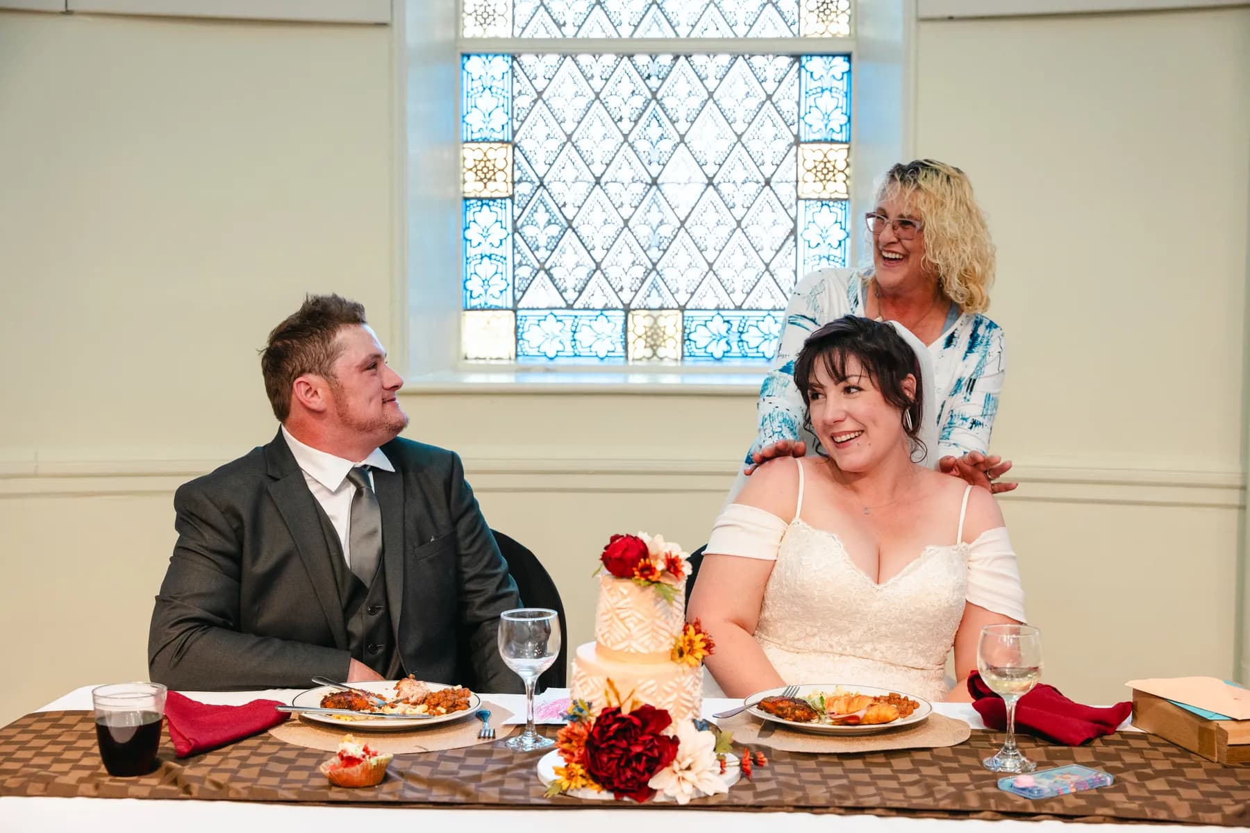 The couple at the head table during speeches at Kody and Jaz’s wedding.