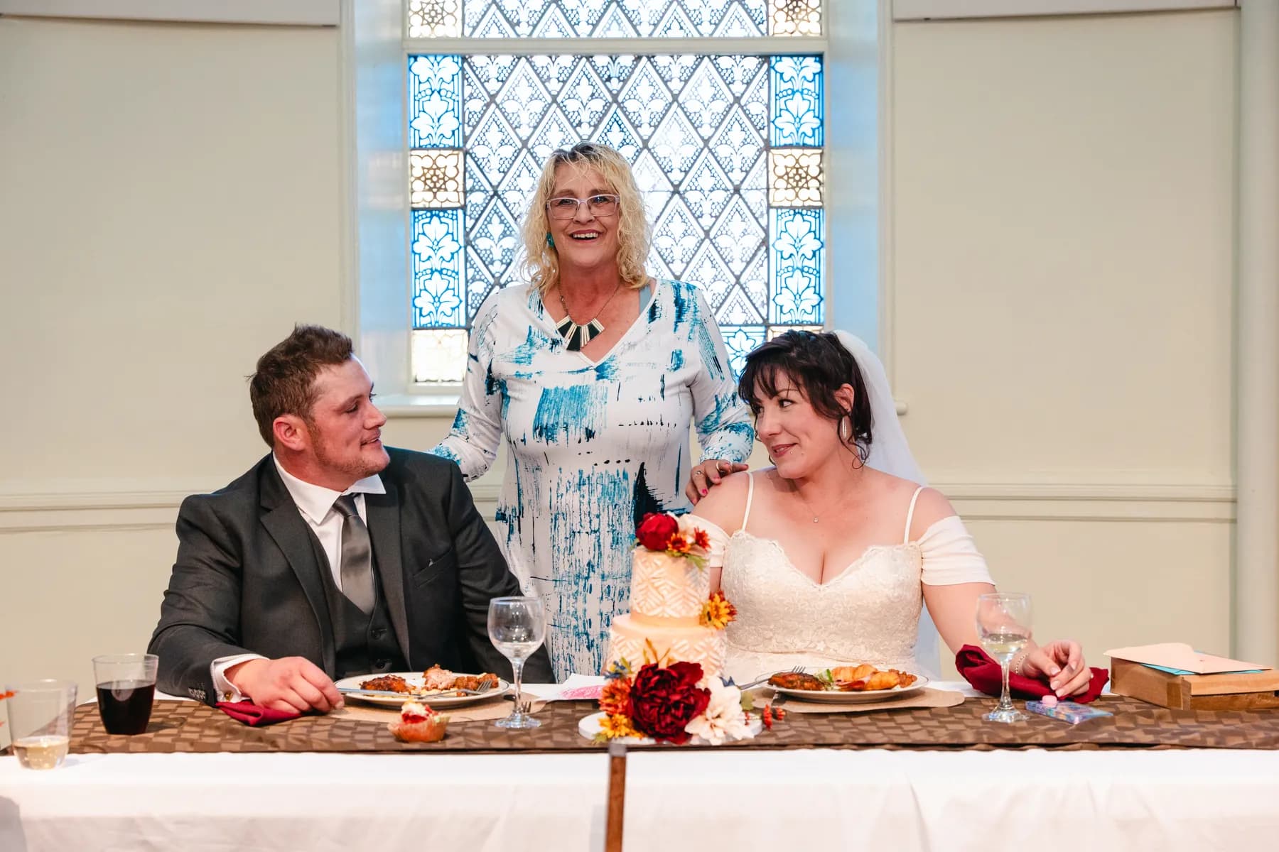 The couple at the head table during speeches at Kody and Jaz’s wedding.