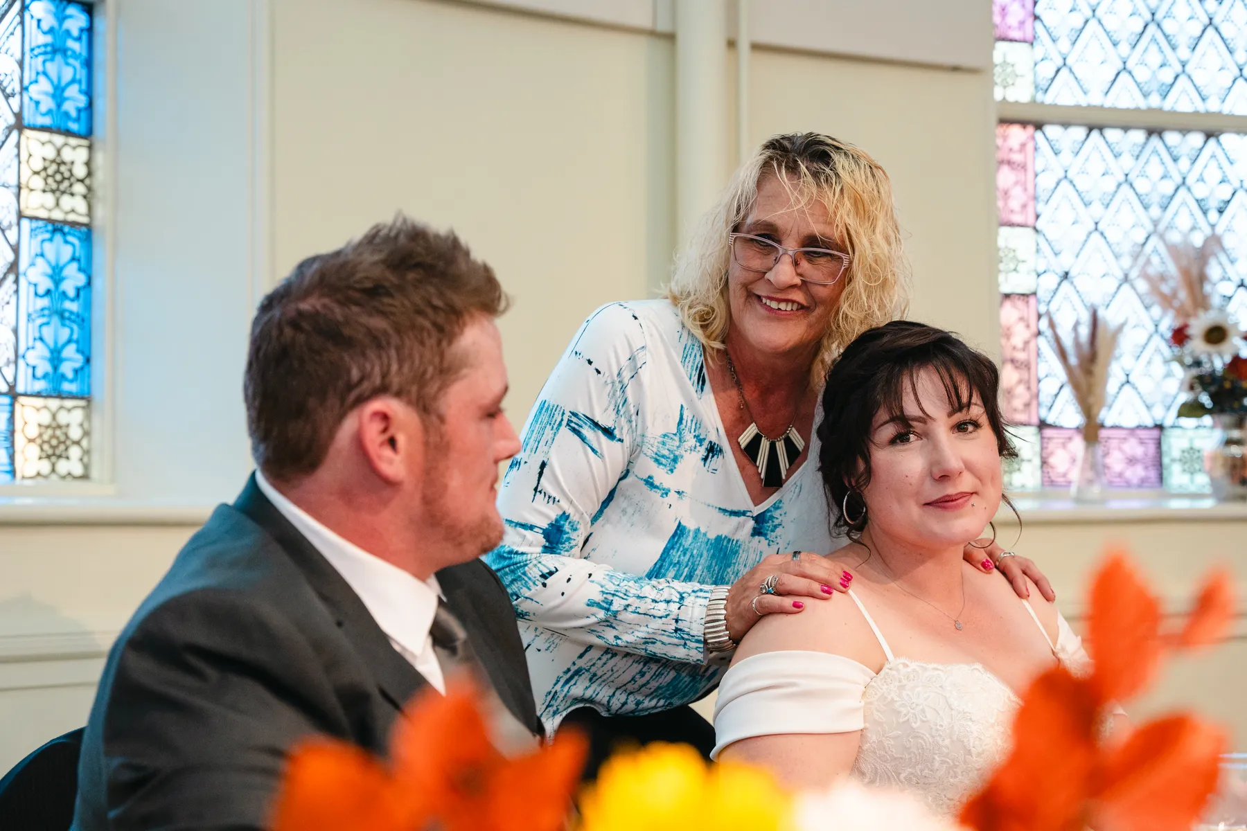 The couple at the head table during speeches at Kody and Jaz’s wedding.