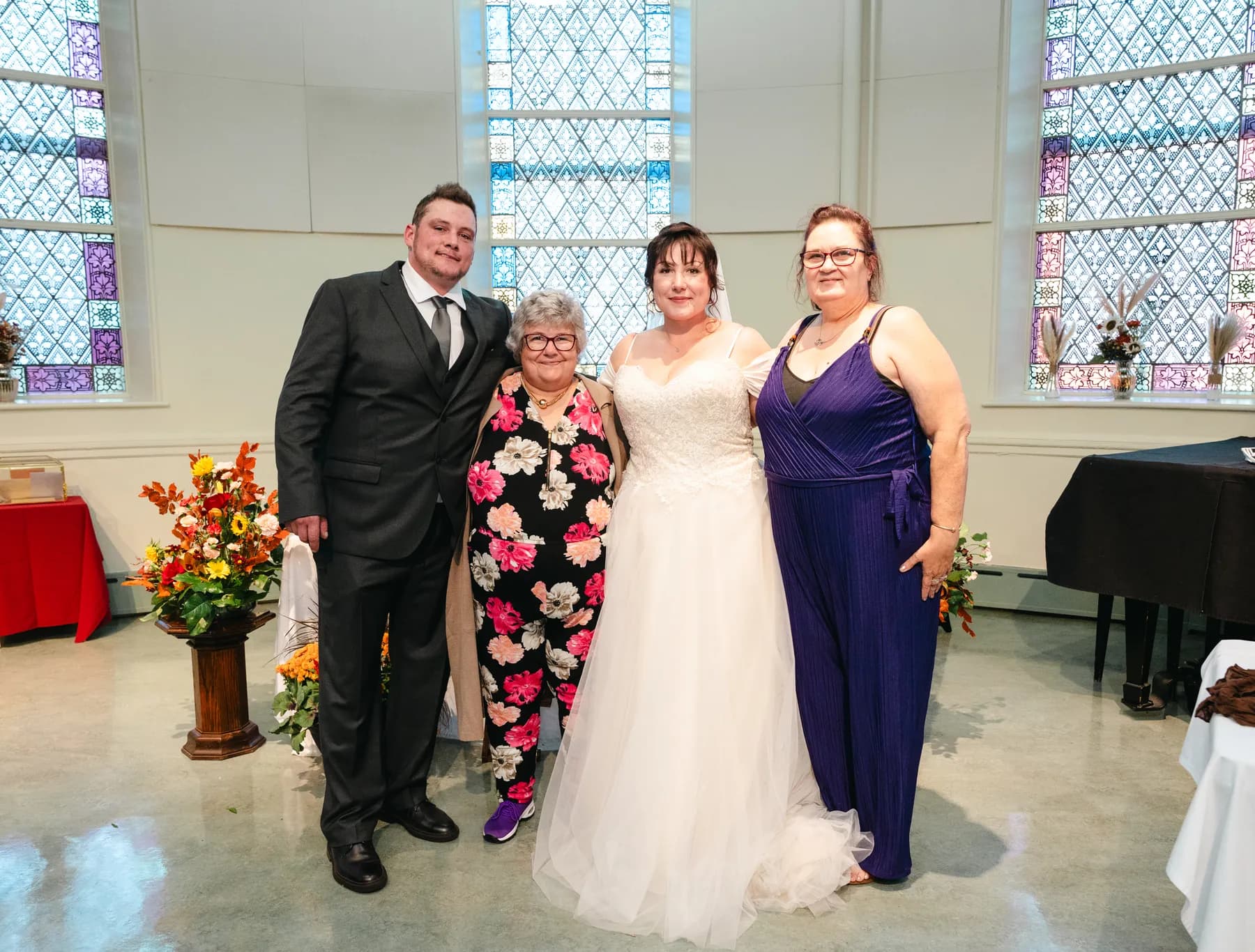 The couple with guests at the reception at Kody and Jaz’s wedding.