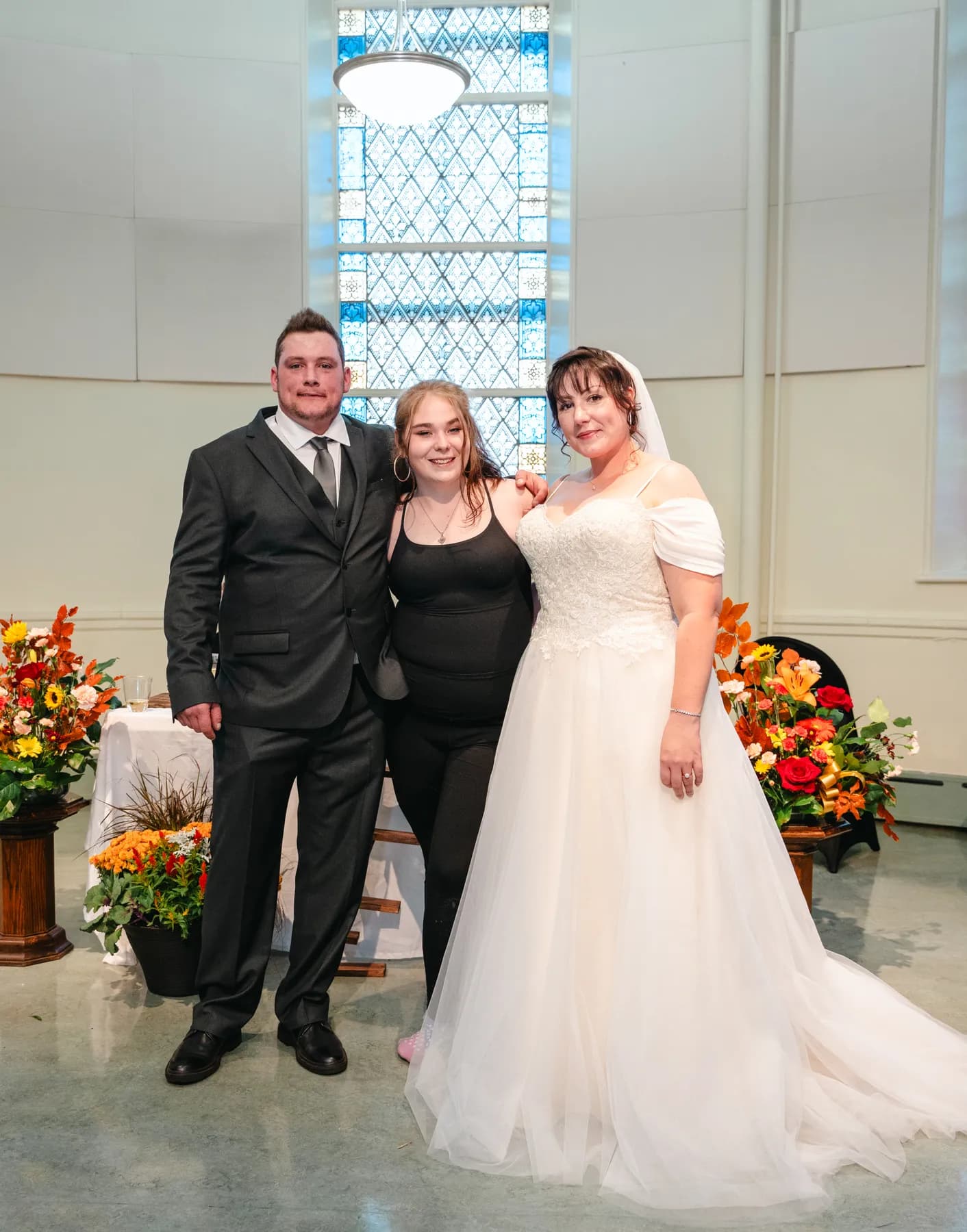 The couple with guests at the reception at Kody and Jaz’s wedding.