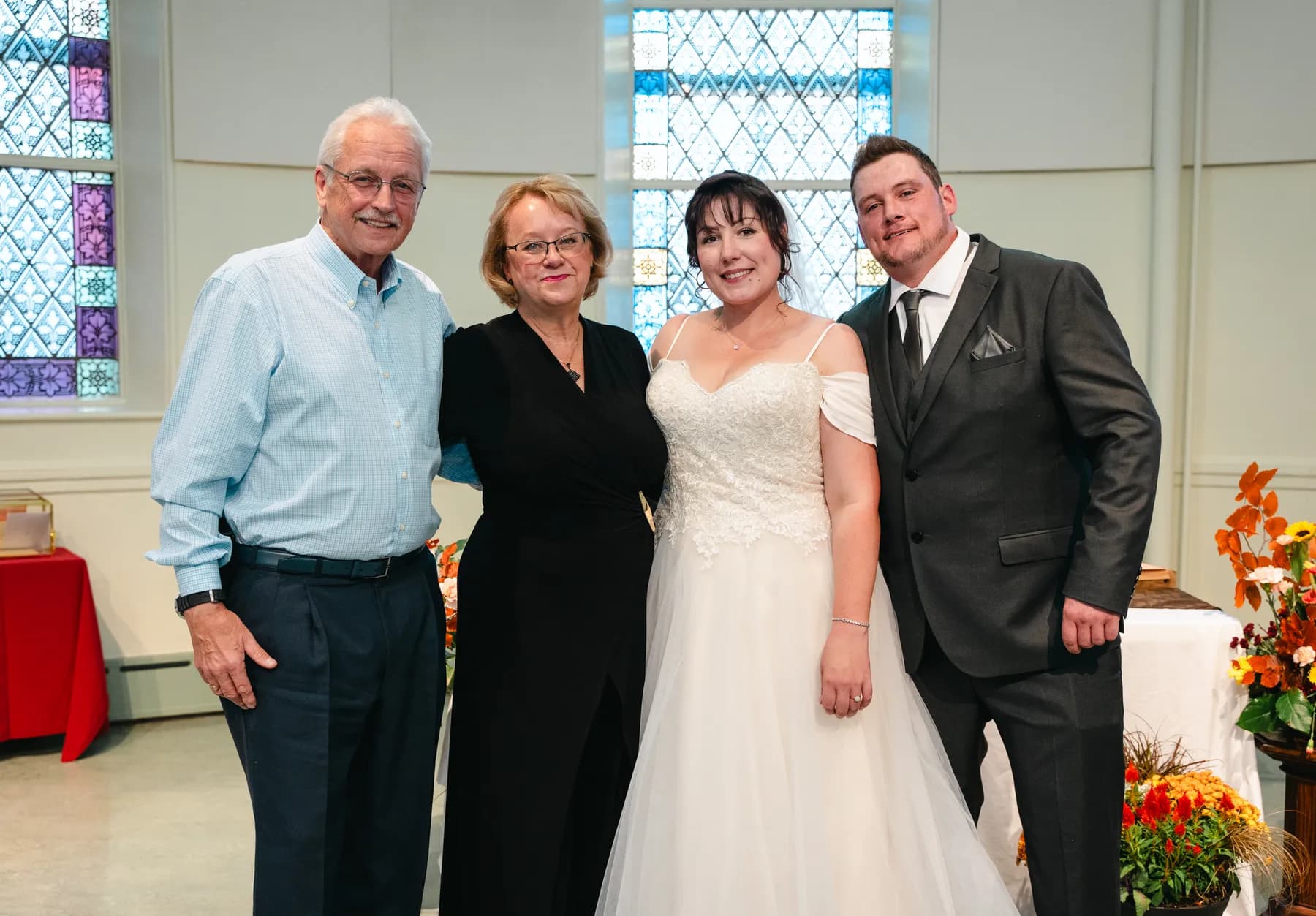 The couple with guests at the reception at Kody and Jaz’s wedding.