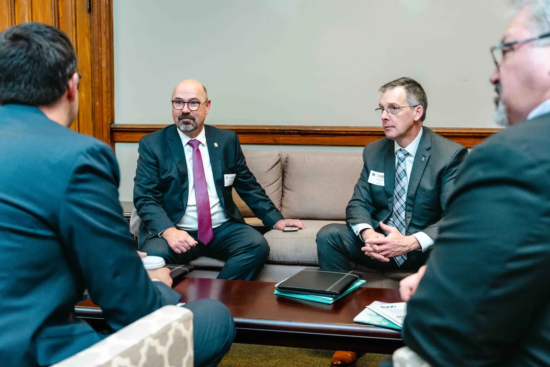 Participants meeting and talking in an office at the IBAO event at Queen’s Park.