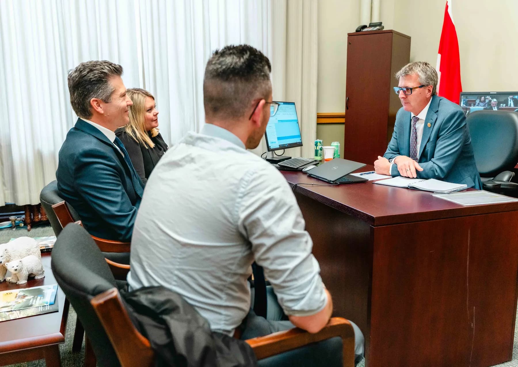 Participants meeting and talking in an office at the IBAO event at Queen’s Park.