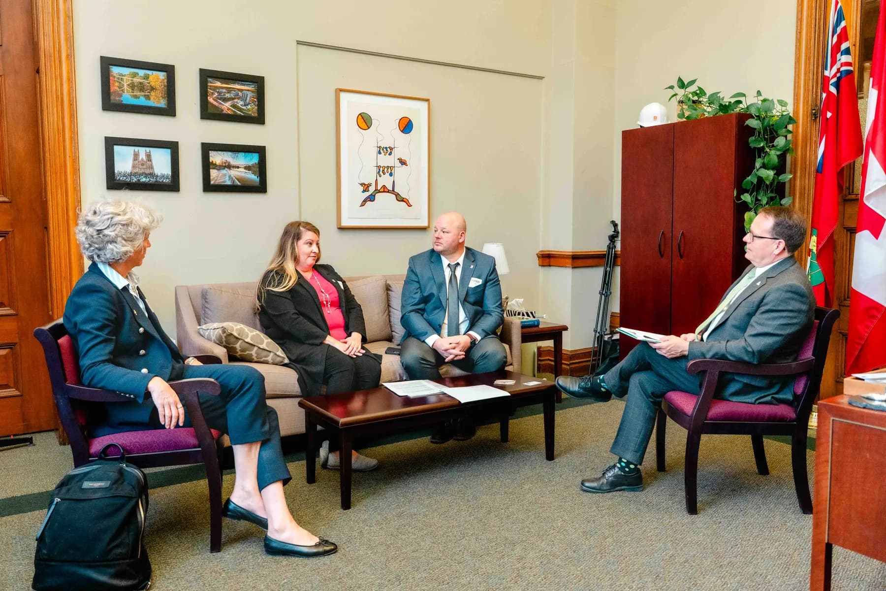 Participants meeting and talking in an office at the IBAO event at Queen’s Park.