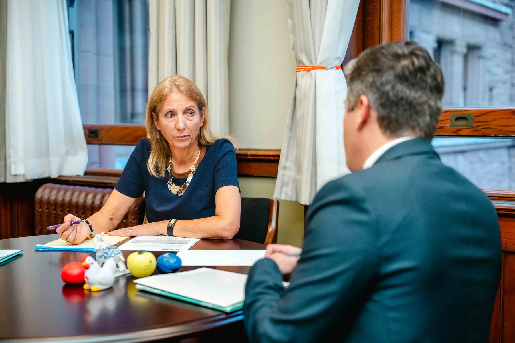 Participants meeting and talking in an office at the IBAO event at Queen’s Park.
