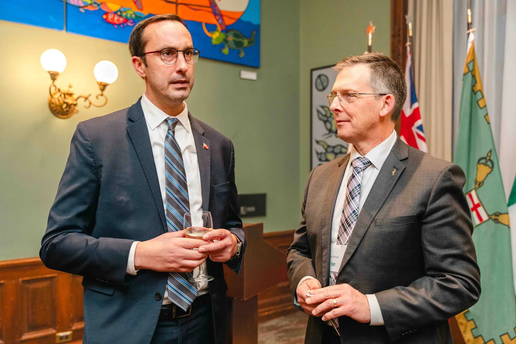 Two participants talking together at the IBAO event at Queen’s Park.