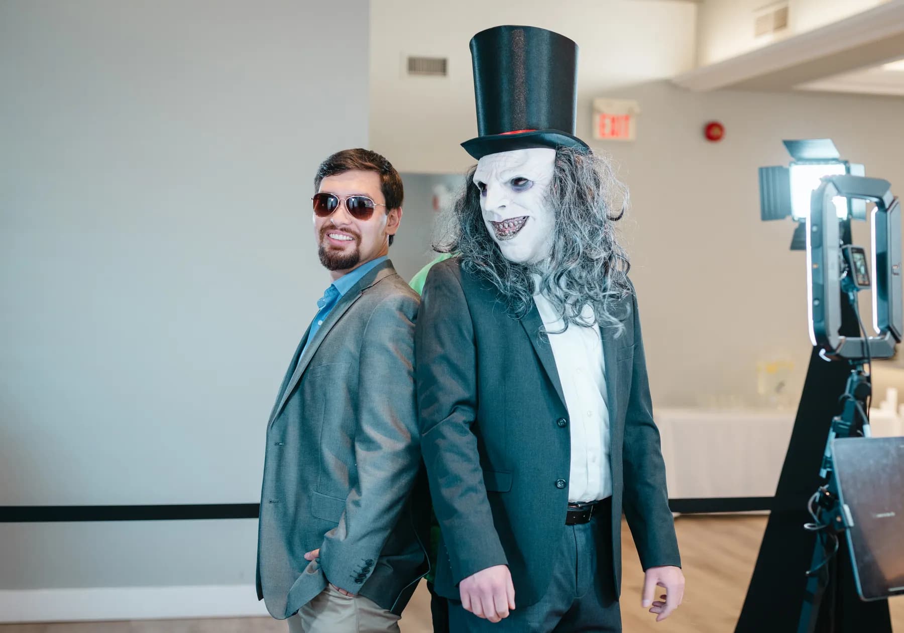 Guests posing in Halloween costumes at Jenna and Jake’s Halloween party.