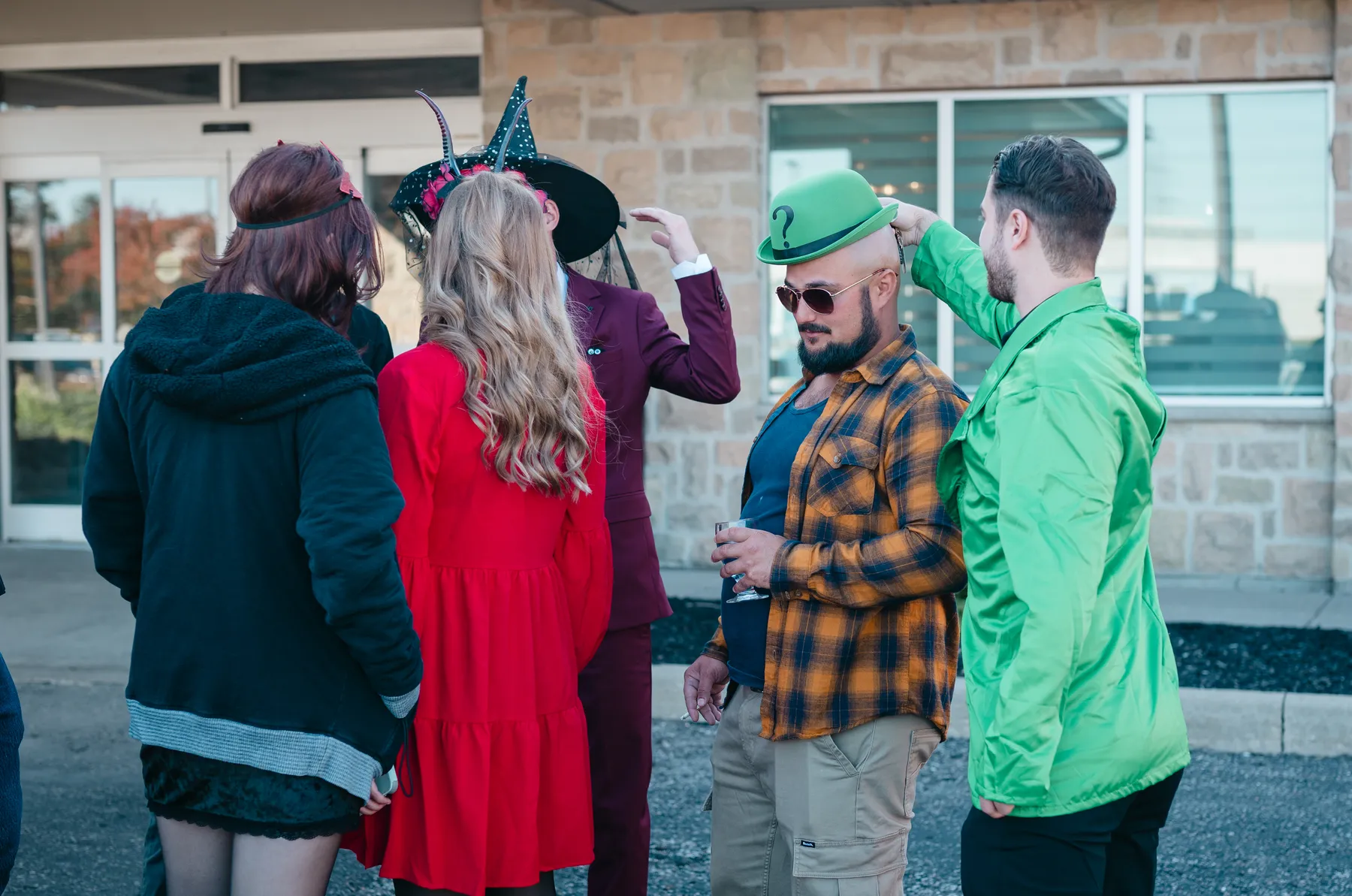 Costumed guests socializing at Jenna and Jake’s Halloween party.